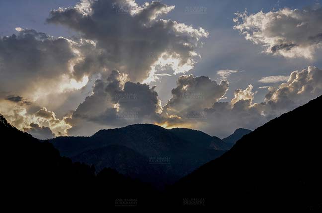Clouds- Sky with Clouds (Harsil Valley) Clouds, Harsil, Uttarakhand, India- June 12, 2013: After sunset, dark sky with clouds over the beautiful Harsil valley in the evening at Harsil, Uttarakhand, India. by Anil