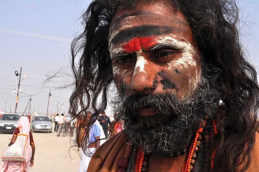 Culture- Aghori Sadhu, Uttar Pradesh (India). Aghori Sadhu with long hairs, ash and tilak on face wearing rudraksha bead at Mahakumbh mela, Allahabad, Uttar Pradesh, India. by Anil