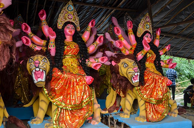Festivals- Durga Puja Festival Durga Puja Festival, Noida, Uttar Pradesh, India- September 20, 2017: Indian Goddess Durga’s clay idol in a workshop under Preparation for the traditional Durga Puja festival at Noida, Uttar Pradesh, India. by Anil