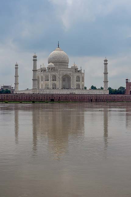 Monuments- Taj Mahal, Agra (India) The Beauty of Taj Mahal in rainy season with flooded river Yamuna water all arround at Agra, Uttar Pradesh, India. by Anil