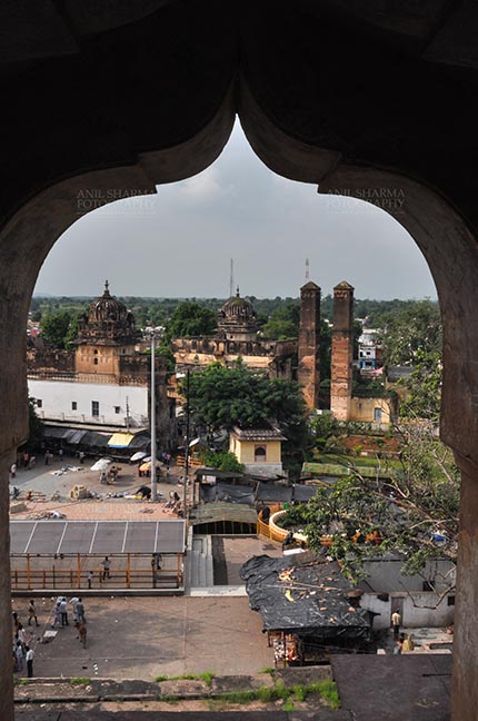 Monuments- Palaces and Temples of Orchha Orchha, Madhya Pradesh, India- August 20, 2012: View from a carved window of Chaturbhuj temple, Orchha, Madhya Pradesh, India. by Anil