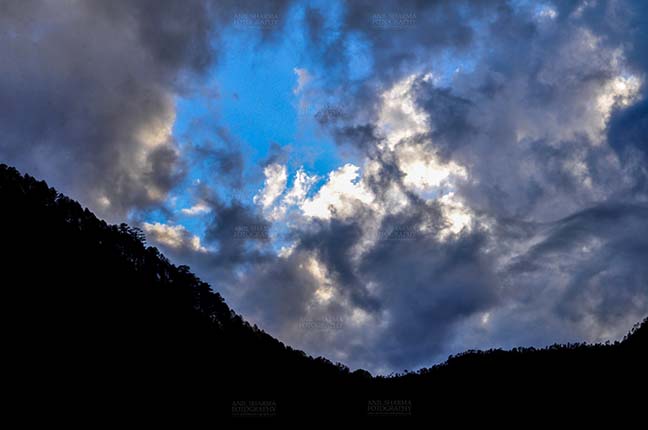 Clouds- Sky with Clouds (Uttarkashi) Clouds over Uttarkashi Hills, Uttarakhand, India-  June 17, 2013: Blue sky in the evening with grey color  clouds over the hills of Uttarkashi, Uttarakhand, India. by Anil