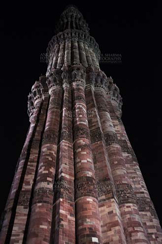 Monuments- Qutab Minar in Night, New Delhi, India. Qutab Minar with Architecure details and verses from Holy Quran at Qutab Minar Complex, New Delhi, India. by Anil