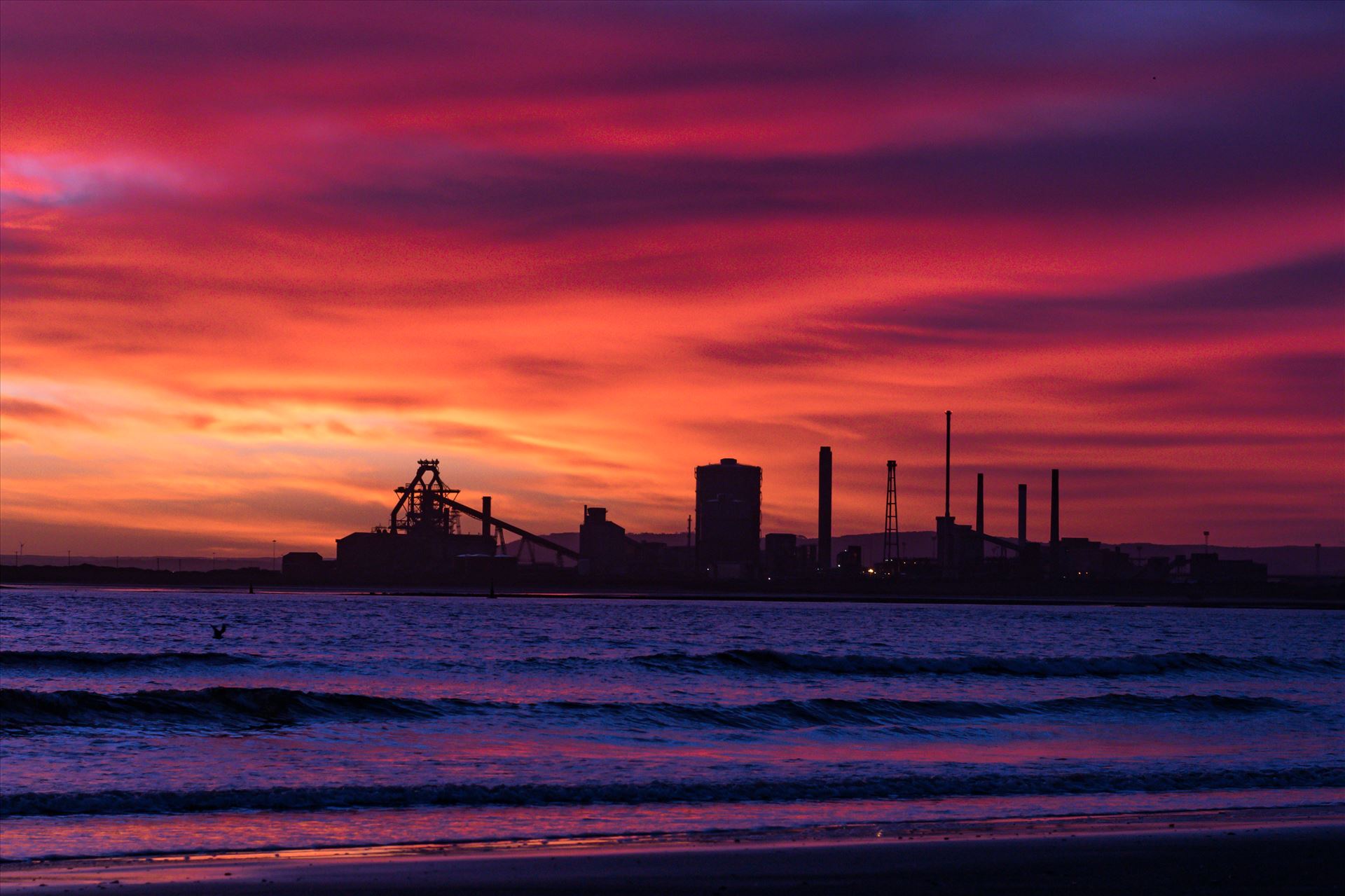 SSI Redcar Steel Works Sunrise, Red sky in the Morning Taken on the 2/01/18 on a very cold Seaton Beach looking over the river to SSI Redcar Steel Works by AJ Stoves Photography