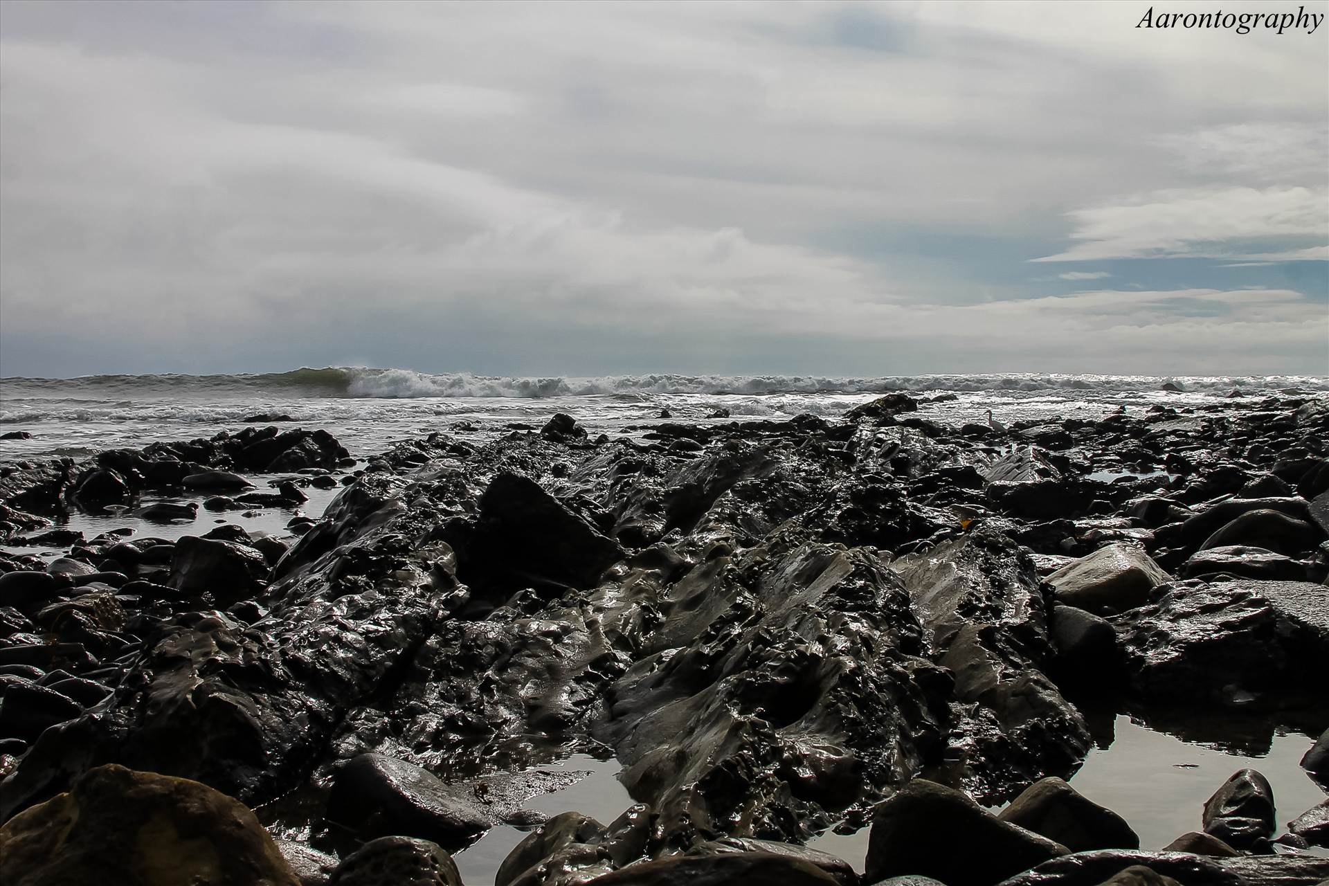 Rocks and Surf.jpg undefined by Aaron