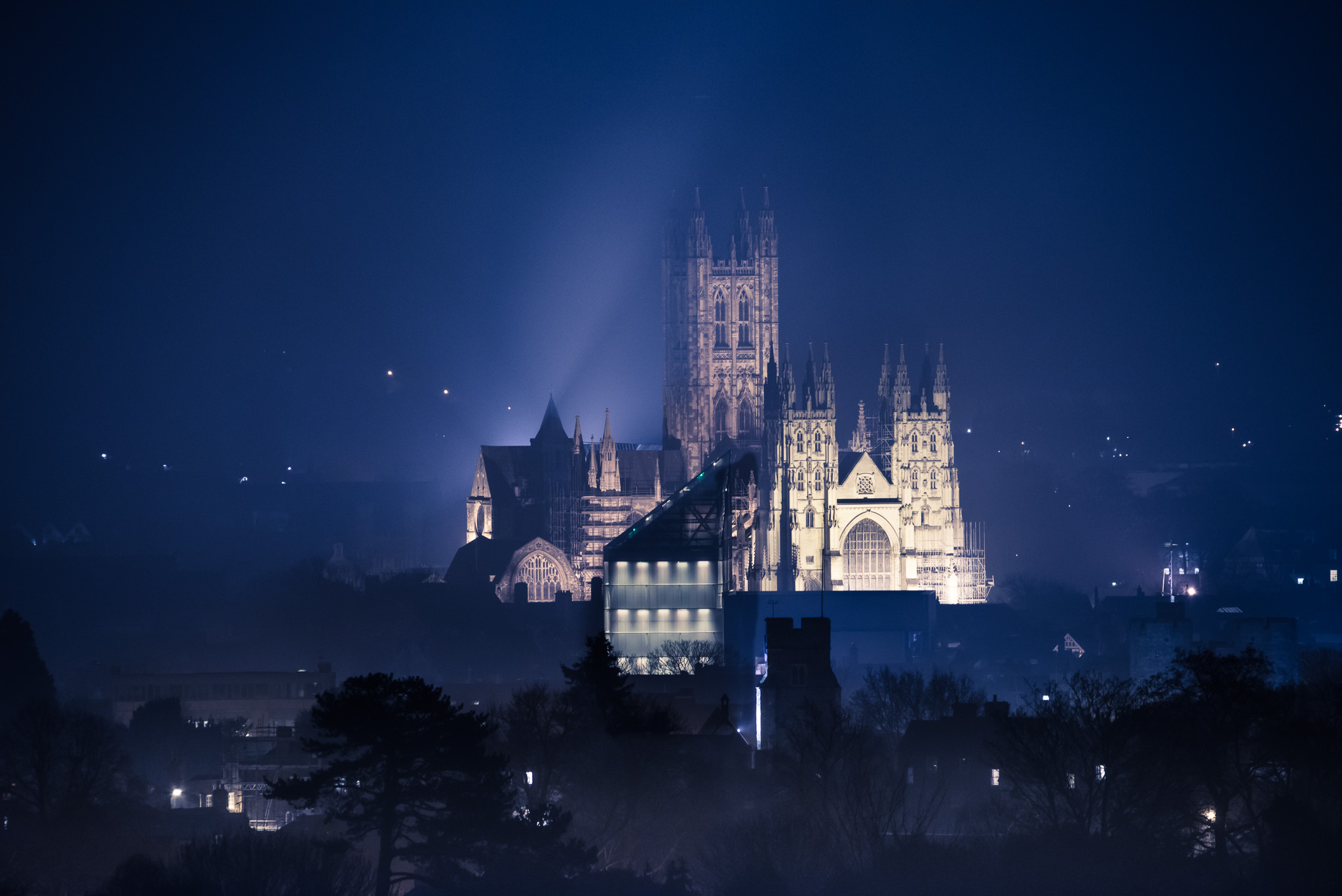 Canterbury Cathedral This image was taken from the north of the city on a cool winter's evening.  The building in front with a lot of lights on is the award winning Marlowe Theatre. by Jimages