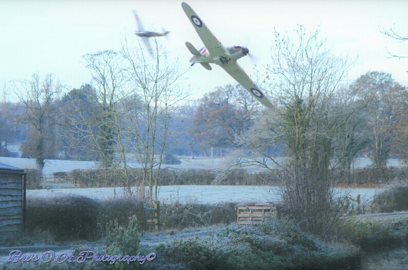 Dangerous Low Flying Here 2 Hawker Hurricanes practice mock dog fight escapes over the English countryside during the cold winter months of 1940 by WPC-21