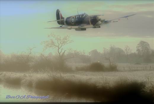 Warrior king - A Supermarine Spitfire flyin low by a Shropshire canal during a cold misty morning in the winter months of 1940
