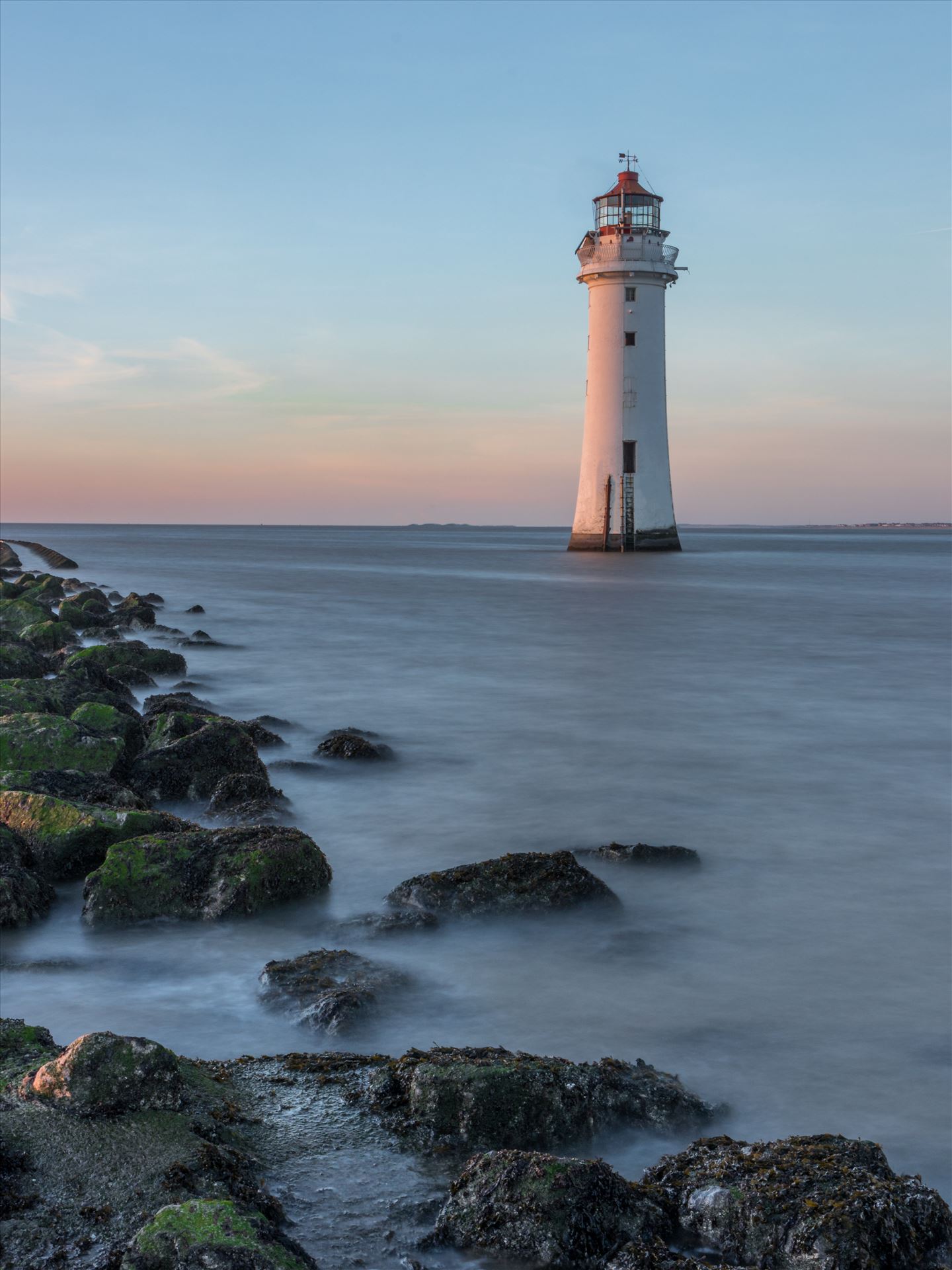 Perch Rock Lighthouse at Sunset Long Exposure shot of Perch Rock Lighthouse at New Brighton near Liverpool as sunset was approaching.  by Tony Keogh Photography