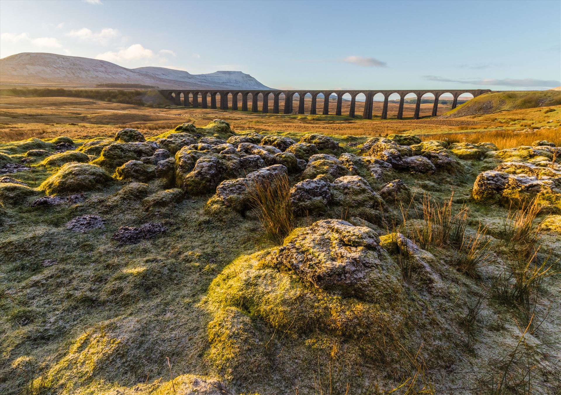 Ribblehead Viaduct 1 Sunrise at the famous Ribblehead Viaduct with Ingleborough in the background and Whernside behind me. The famous Settle to Carlisle railway runs along here. by Tony Keogh Photography