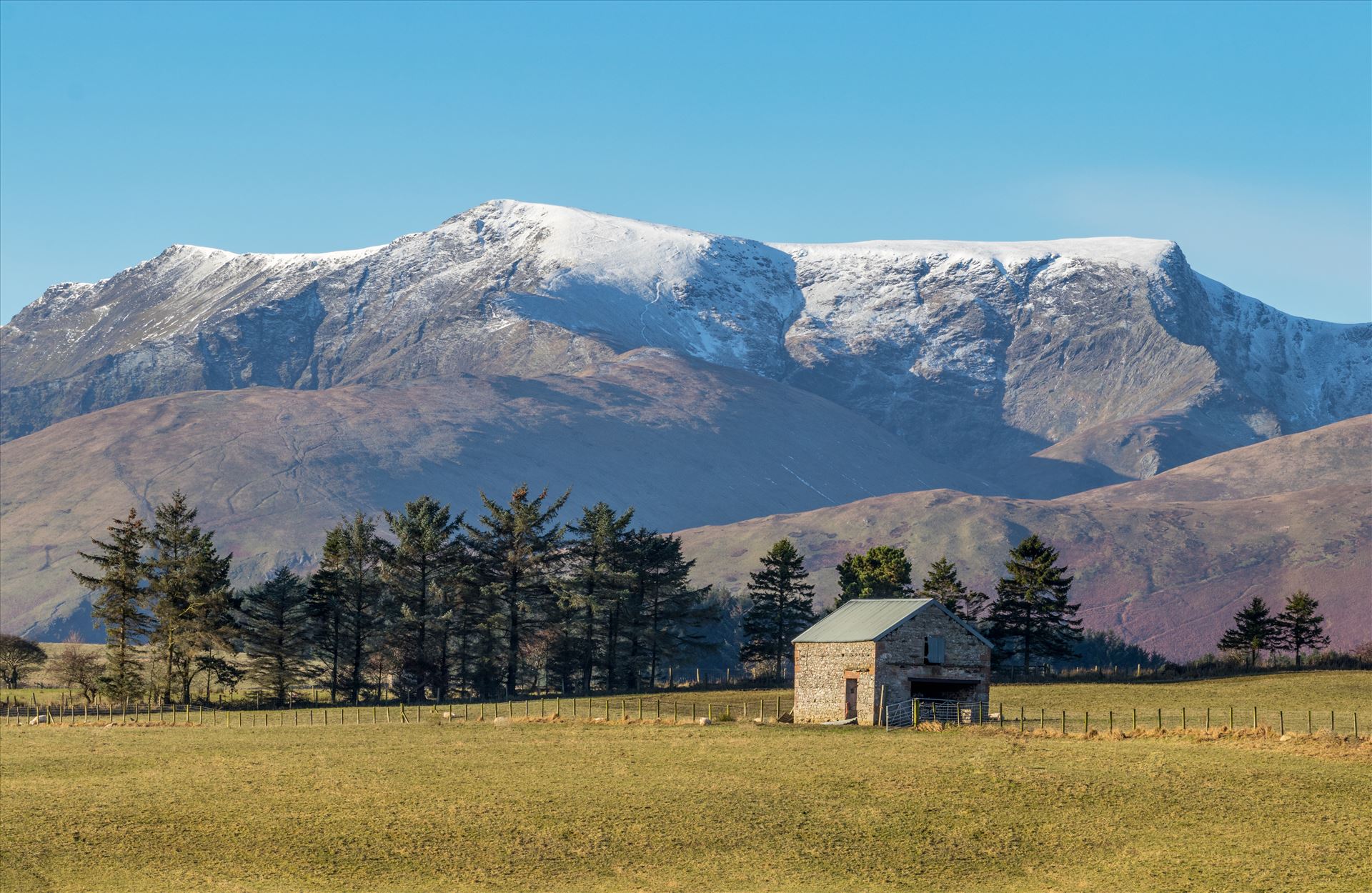 Blencathra A snow topped Blencathra also known as Saddleback in the Lake District in the North of England as viewed  heading towards Keswick. by Tony Keogh Photography
