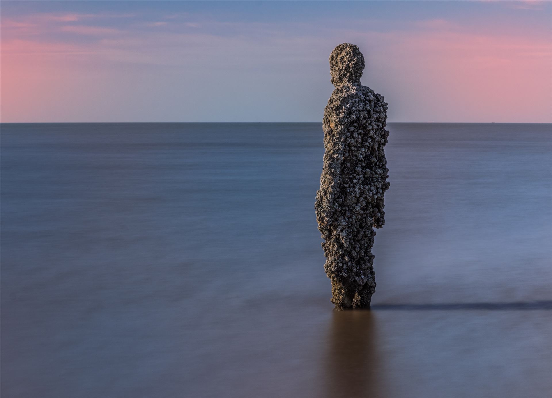 Anthony Gormley Statue on Crosby Beach Long Exposure shot at Another Place that is a series of statues by Anthony Gormley on Crosby Beach near Southport. by Tony Keogh Photography