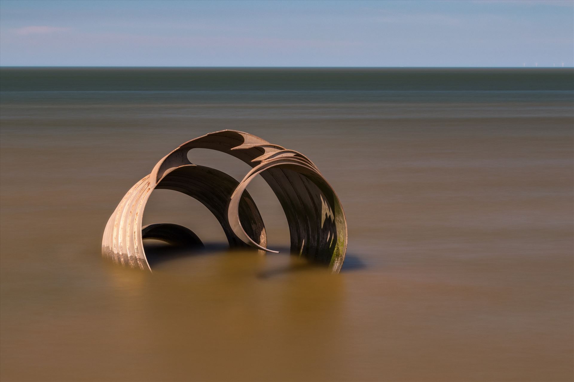 Mary's Shell on the beach at Cleveleys The famous "Mary's Shell" is a metal sculpture on the beach at Cleveleys. The views of the sculpture vary dramatically depending on the tide.  by Tony Keogh Photography