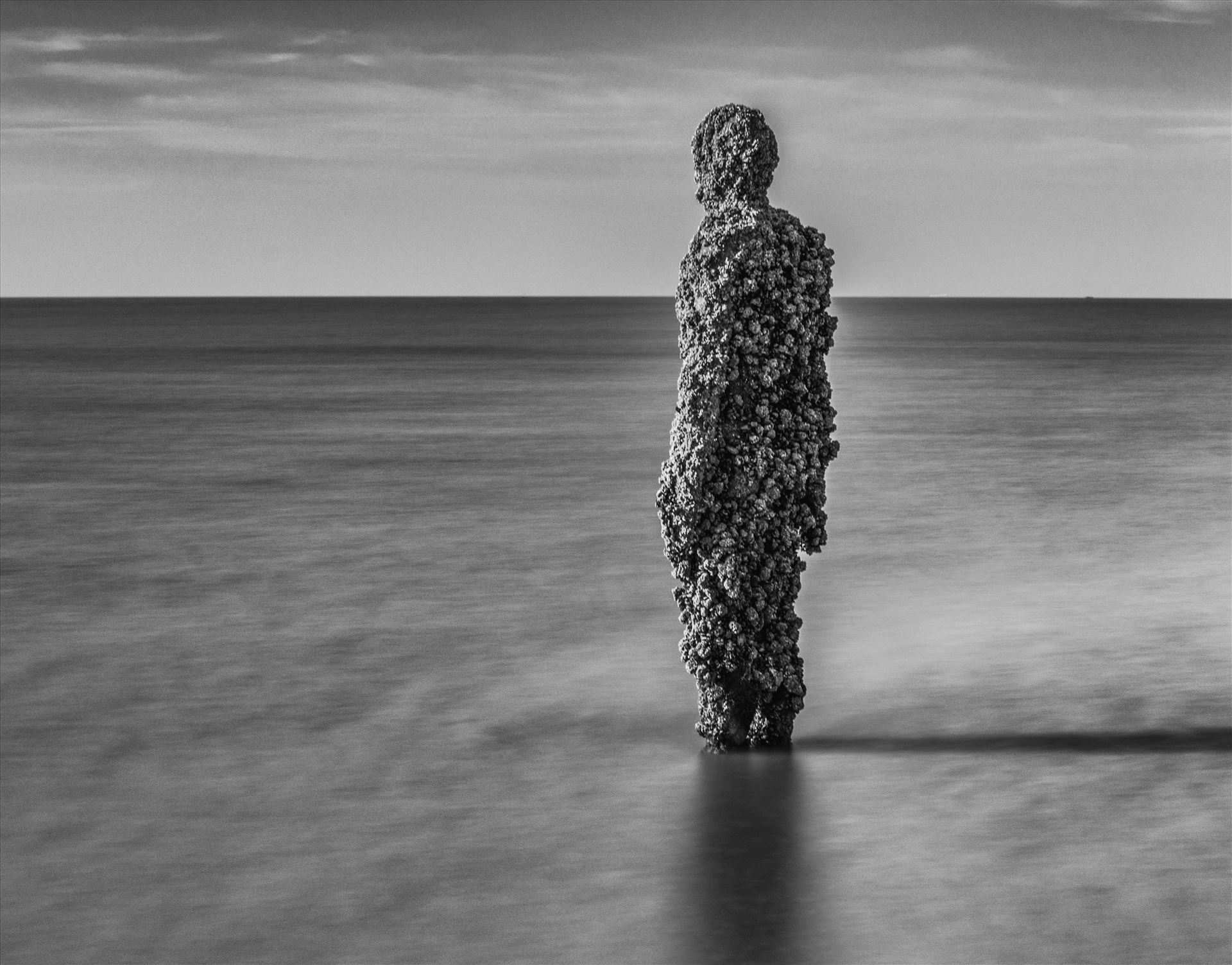 Crosby Beach, Anthony Gormley Statue Long Exposure mono shot at Another Place, a series of statues by Anthony Gormley on Crosby Beach near Southport. by Tony Keogh Photography