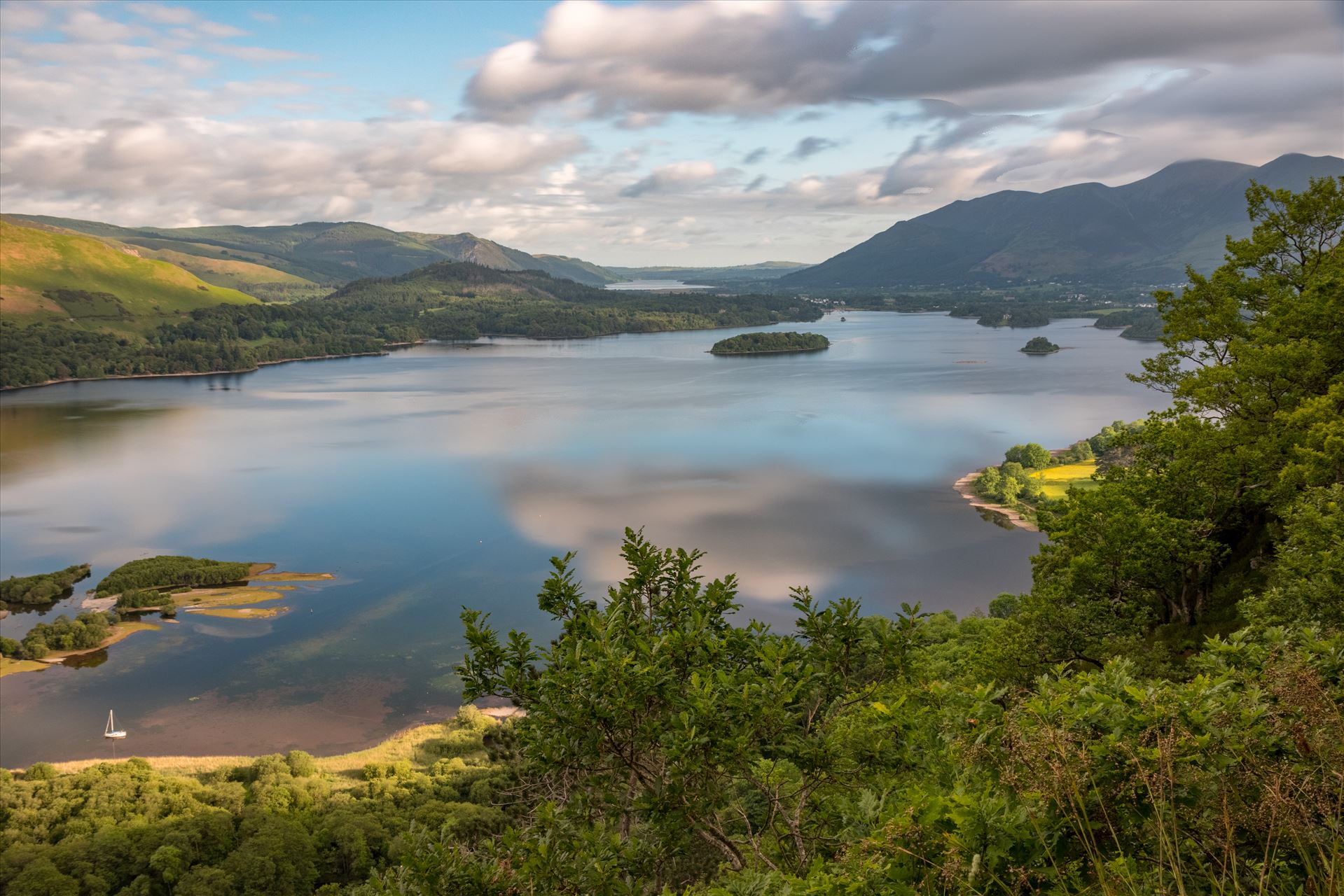 Surprise View looking over Derwent Water Early morning shot at Surprise View in the Lake District overlooking Derwent Water with Keswick to the top right and Catbells just visible to the left. by Tony Keogh Photography