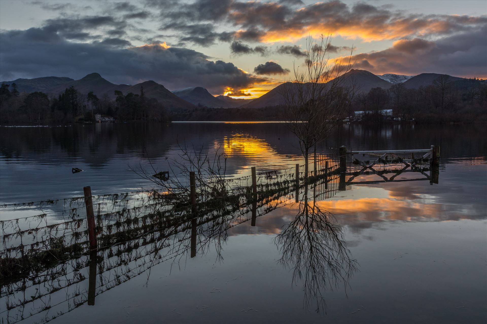 Derwent Water at Sunset Moody looking Derwent Water at sunset in the Lake District. Shot taken from Crow Park just outside Keswick with Catbells in the background. by Tony Keogh Photography