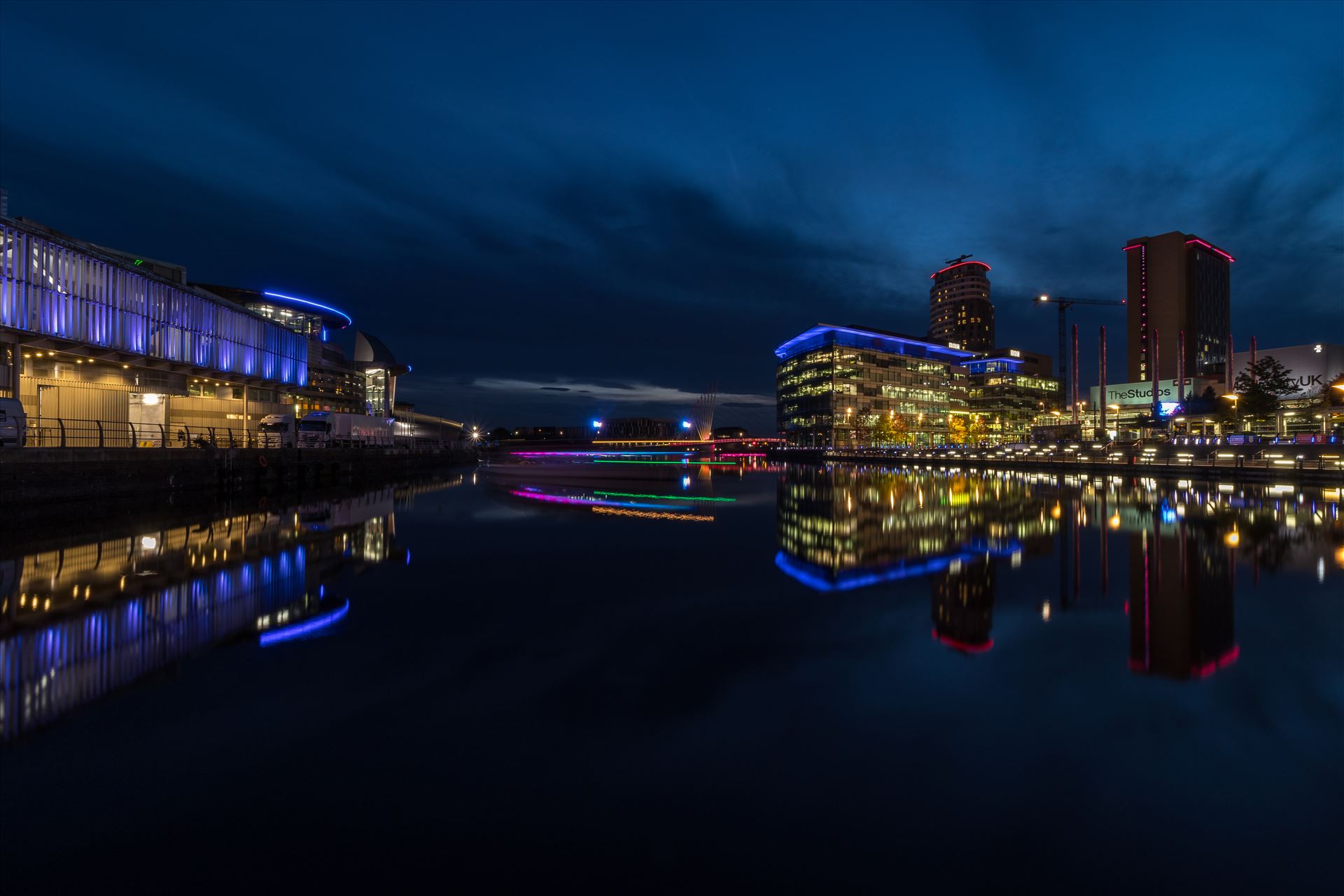 Media City at Night Night time long exposure shot at Media City at Salford Quays near Manchester. The colour in the middle is a slow moving "booze cruise"  by Tony Keogh Photography
