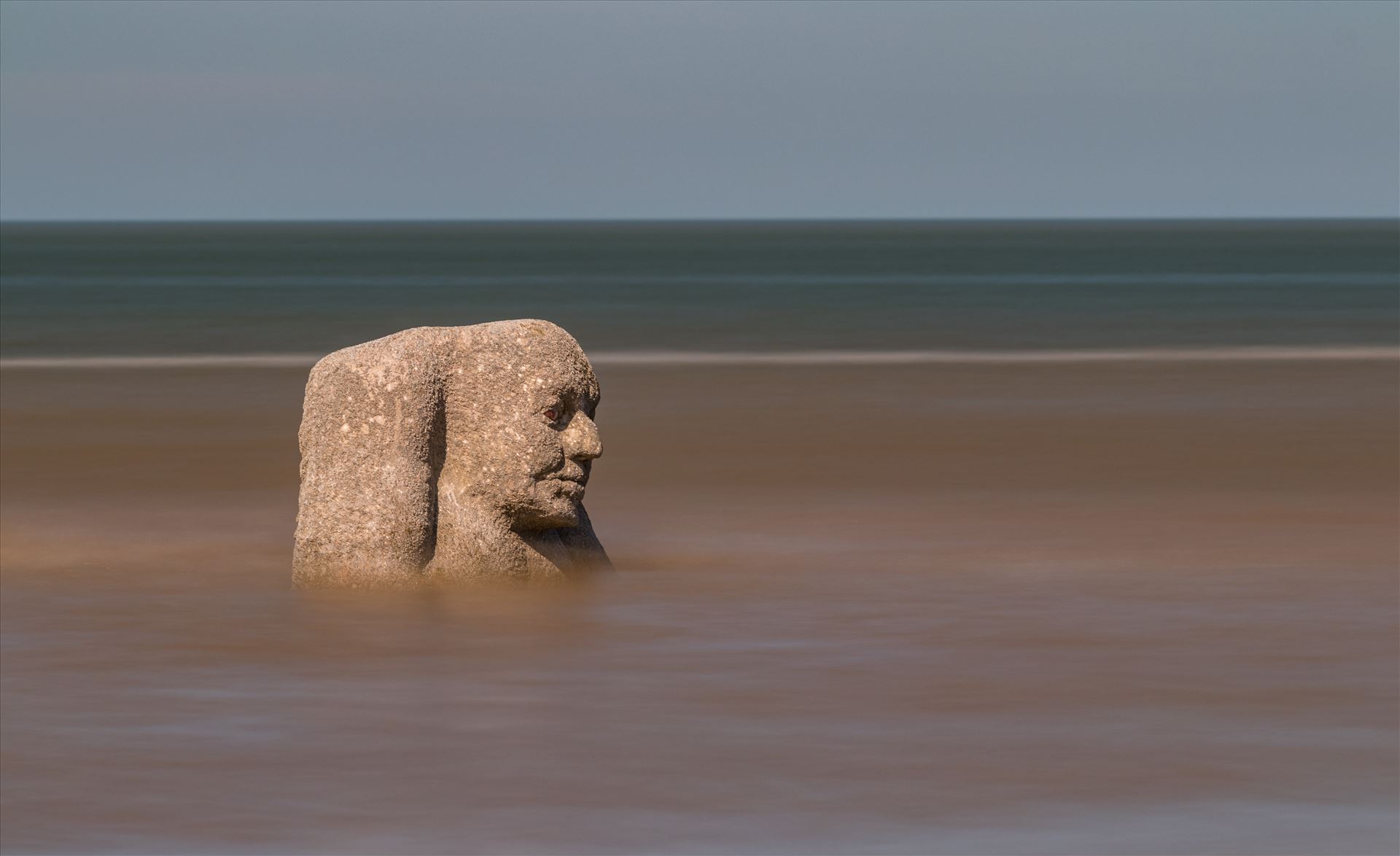 The Ogre on Cleveleys Beach The Ogre is a stone statue situated near Mary's Shell on the beach at Cleveleys on the Fylde Coast. The statue changes dramatically as the tide changes.  by Tony Keogh Photography