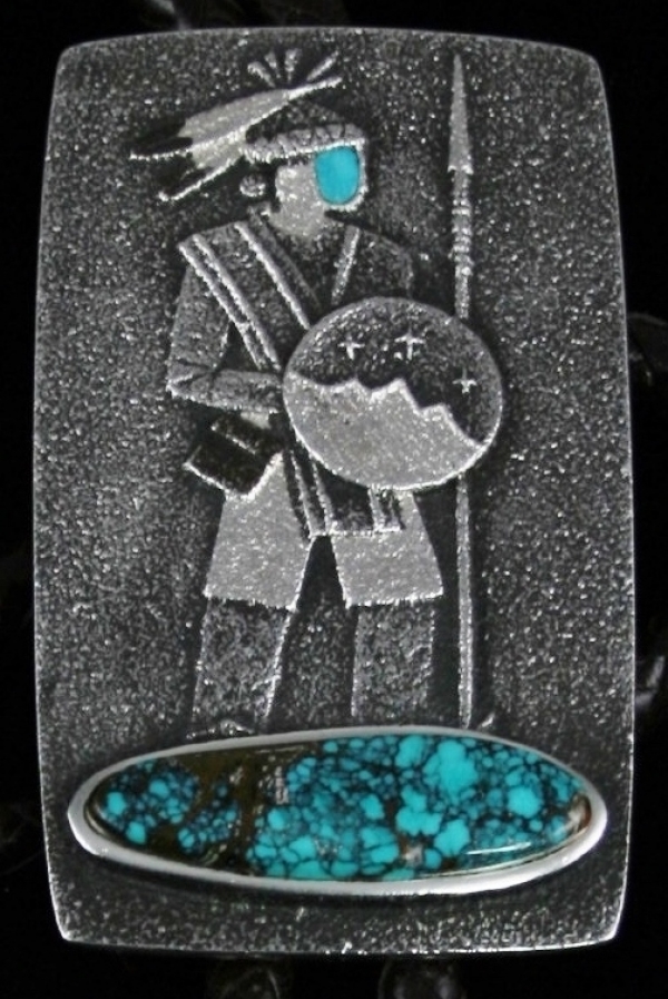 Warrior Bolo by Darryl Dean Begay: Turquoise Direct This image of Turquoise Direct shows a stunning bolo tie designed by Darryl Dean Begay. The warrior design was hand carved out of tufa stone. This bolo is tufa casted to give it a perfectly finished look. http://www.turquoisedirect.com by Turquoisedirect