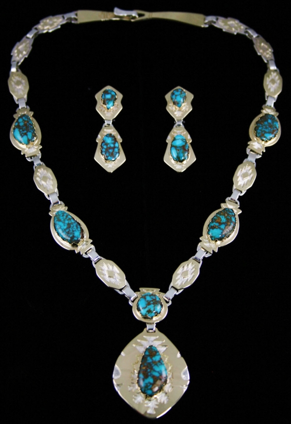 Necklace by Dina Hunting horse: Turquoise Direct Watch this image of Turquoise Direct to have a detailed look of silver necklace and earrings by Dina Hunting horse. This image signifies beauty of the Candelaria turquoise cabochons in the piece. http://www.turquoisedirect.com by Turquoisedirect