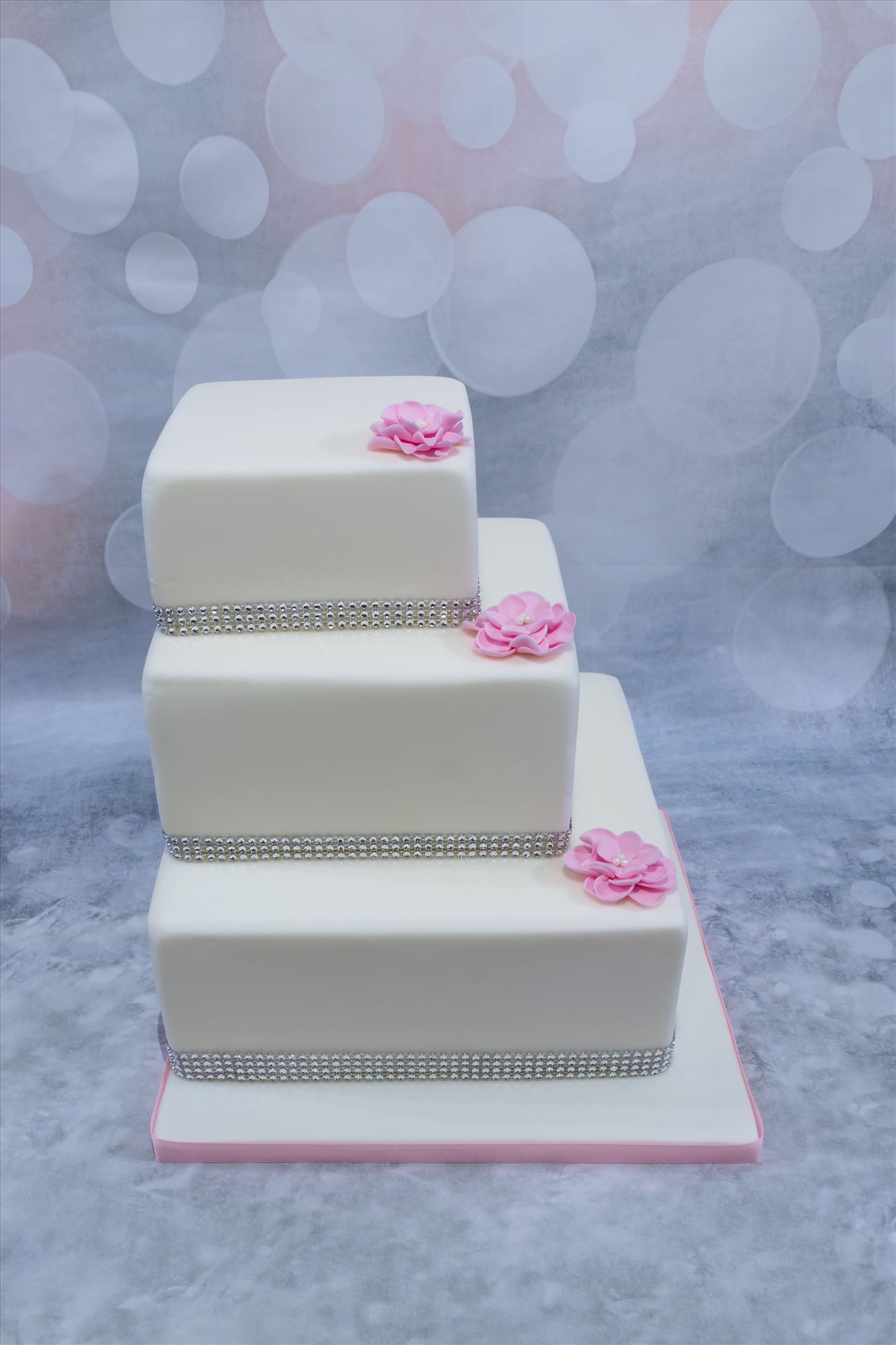 . I'm delighted to publish this photo of my 3 tier square cake design. The cake itself can be made in flavours to suit and also designs to suit. I love the simple but elegant finish to this. by Alison Wonderland Bakes