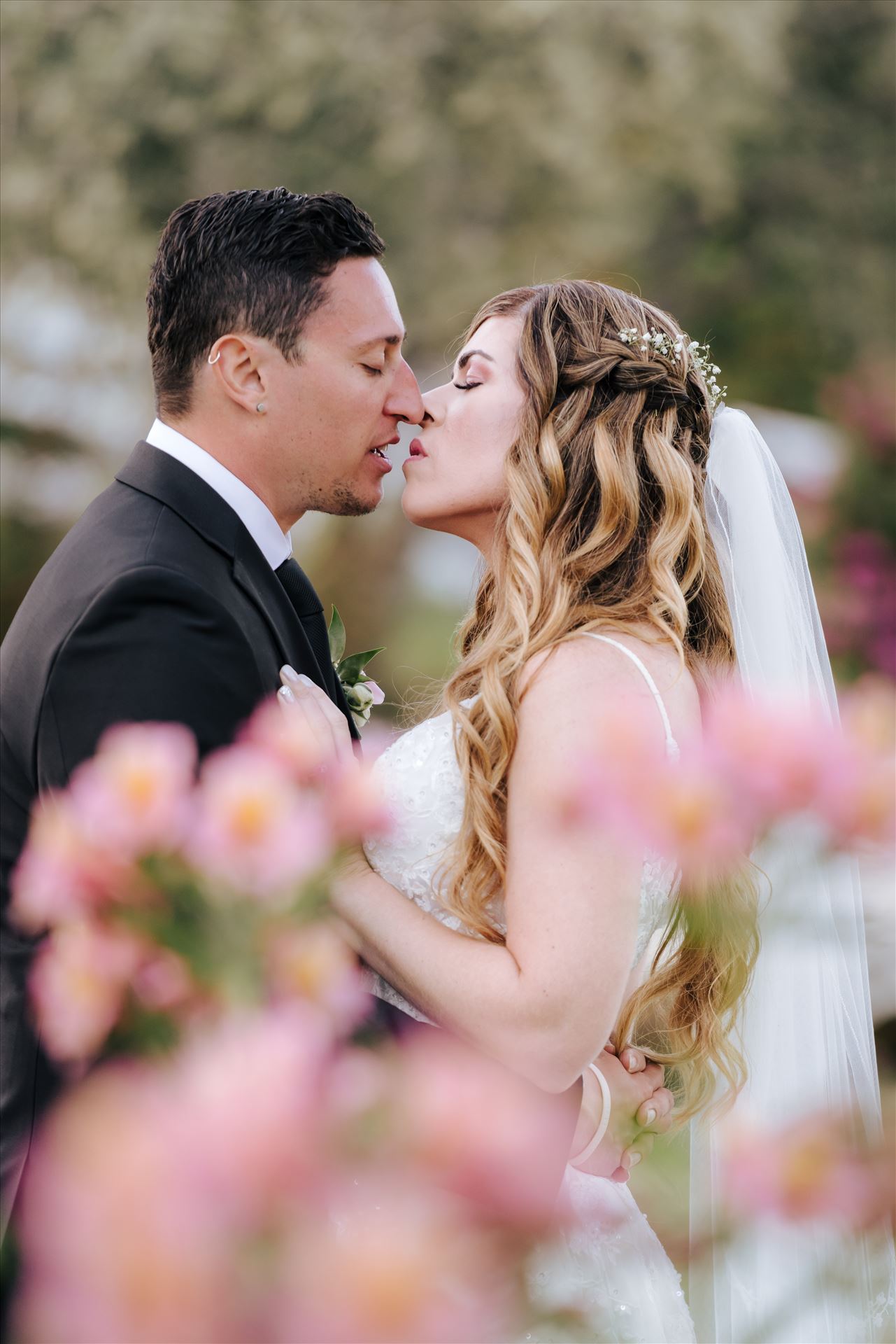 FW-6736.JPG Mirror's Edge Photography, a San Luis Obispo Wedding and Engagement Photographer, captures Rashel and Brian's Wedding Day at the Madonna Inn in San Luis Obispo. A secret kiss in the secret garden. by Sarah Williams
