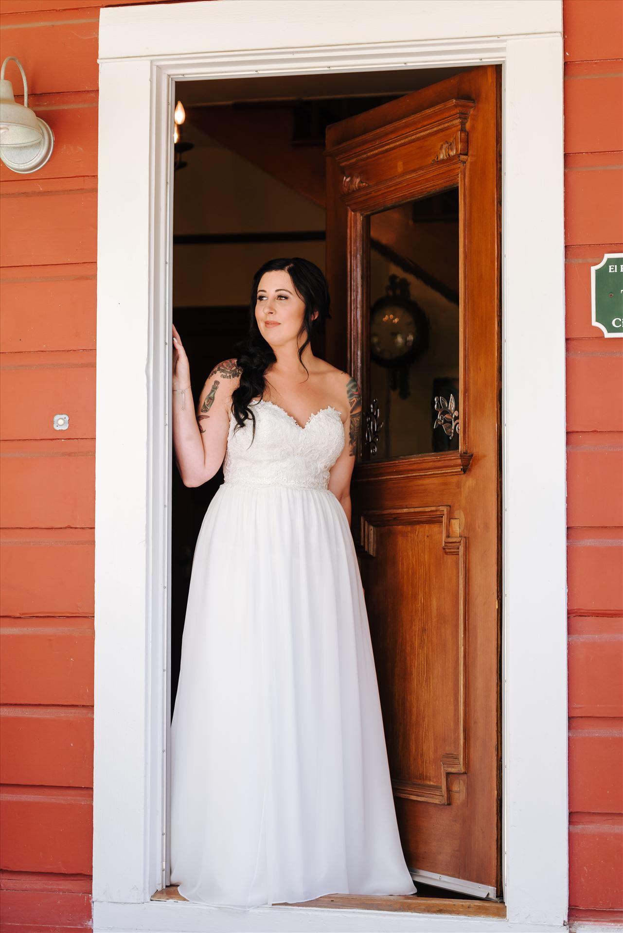 Kendra and Mitchell 027 Emily House Bed and Breakfast Paso Robles California Wedding Photography by Mirrors Edge Photography.  Bride in the doorway by Sarah Williams