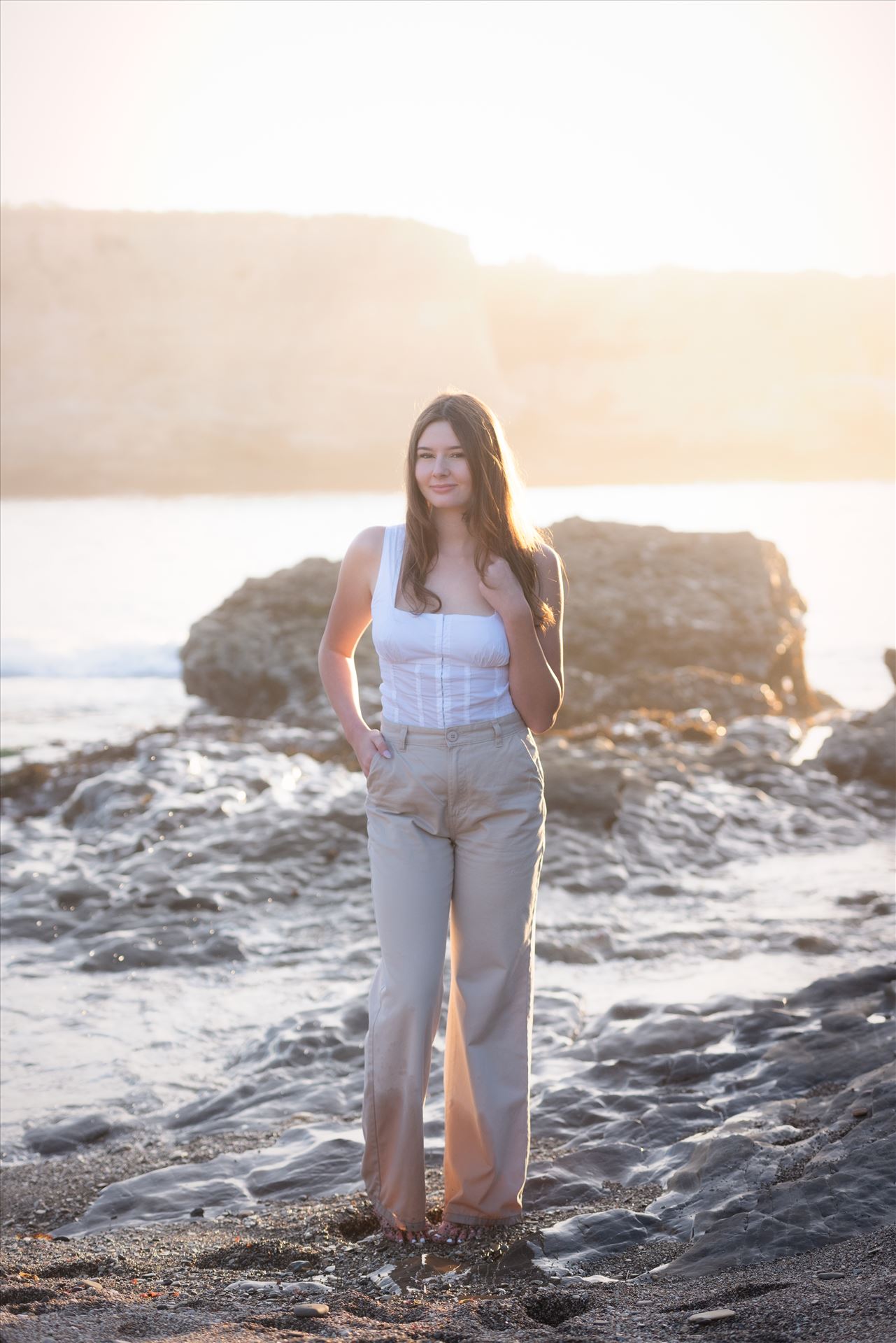 Final-9086.JPG Mirror's Edge Photography a San Luis Obispo Luxury Portrait, Wedding and Engagement Photographer capture Hayley's Senior Portrait Session at Montana de Oro.  Hayley sunflare with water. by Sarah Williams