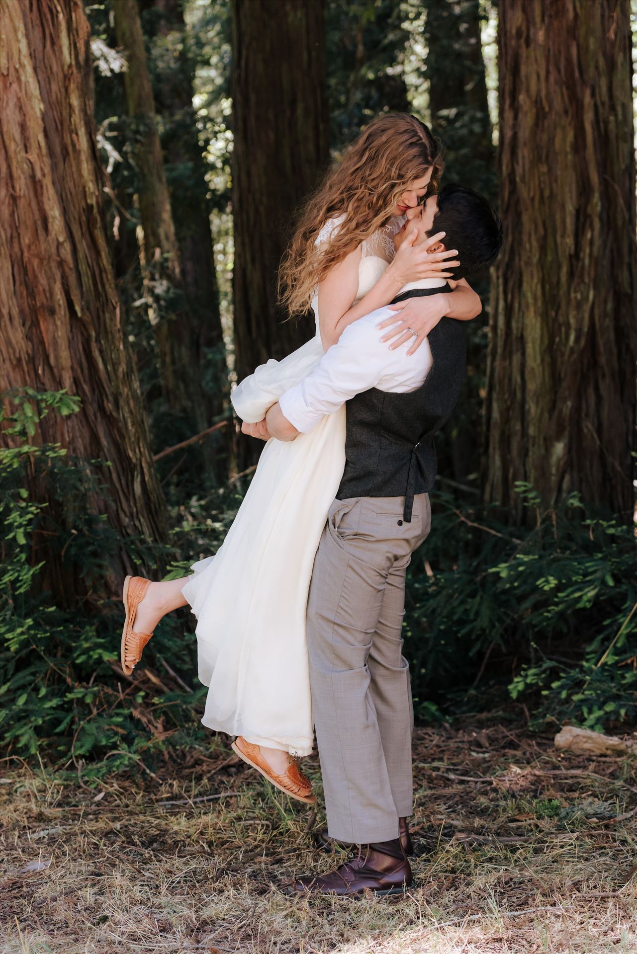 FW-6277.JPG Mt Madonna wedding in the redwoods outside of Watsonville, California with a romantic and classic vibe by sarah williams of mirror's edge photography a san luis obispo wedding photographer.  Groom lifts Bride by Sarah Williams