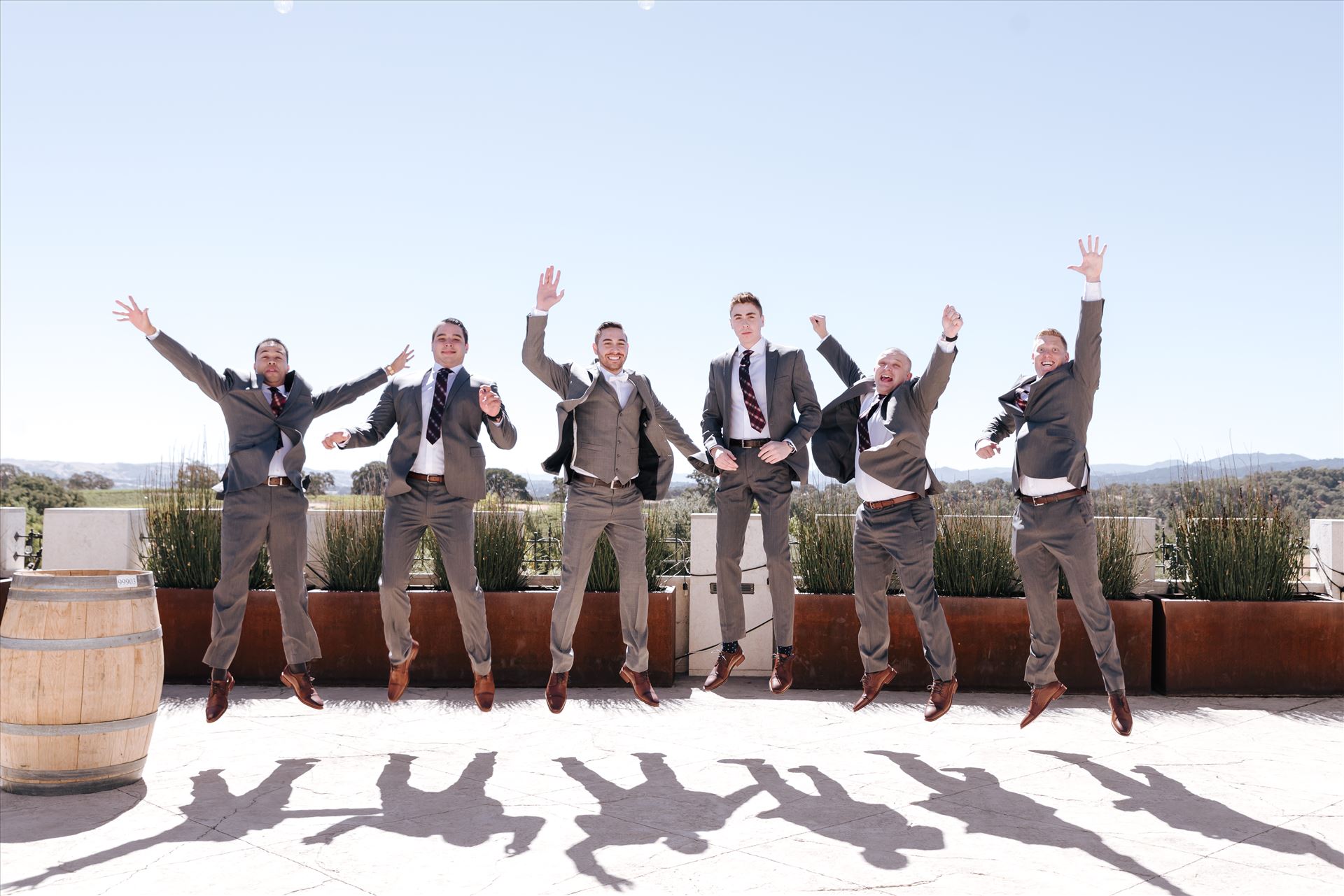Edith and Kyle 004 Mirror's Edge Photography captures Edith and Kyle's wedding at the Tooth and Nail Winery in Paso Robles California. Groom and Groomsmen do the jump. by Sarah Williams