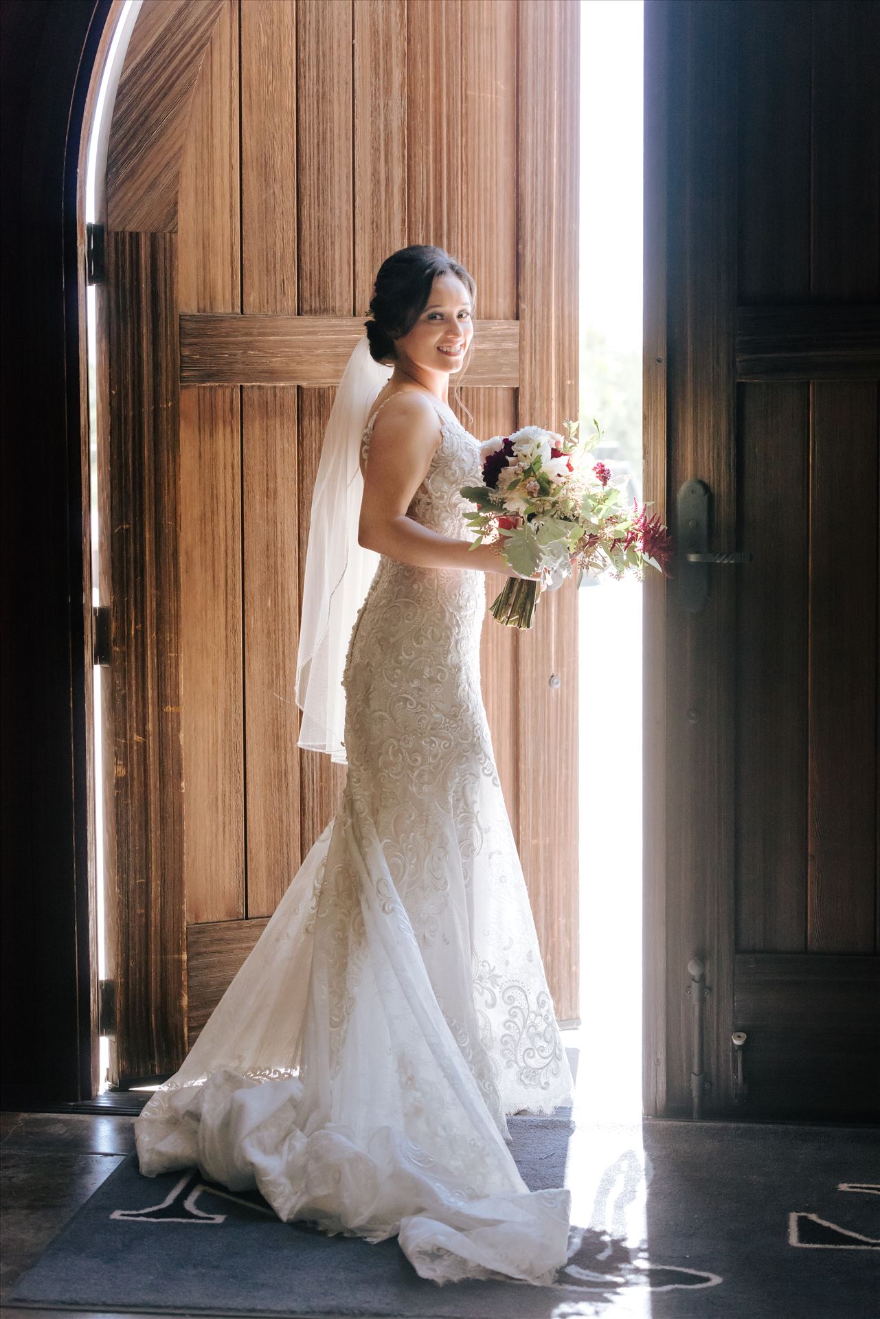 Edith and Kyle 053 Mirror's Edge Photography captures Edith and Kyle's wedding at the Tooth and Nail Winery in Paso Robles California. Bride walks out the door by Sarah Williams