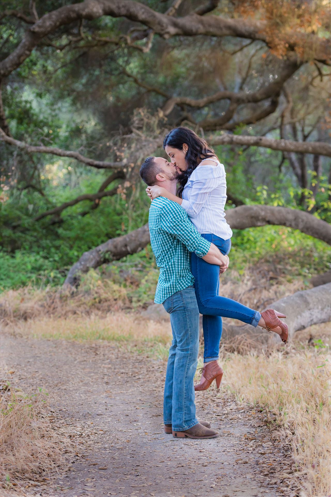 Cinthya and Carlos 61 Los Osos State Park Reserve Engagement Photography and Wedding Photography by Mirror's Edge Photography.  Holding her up with a kiss by Sarah Williams