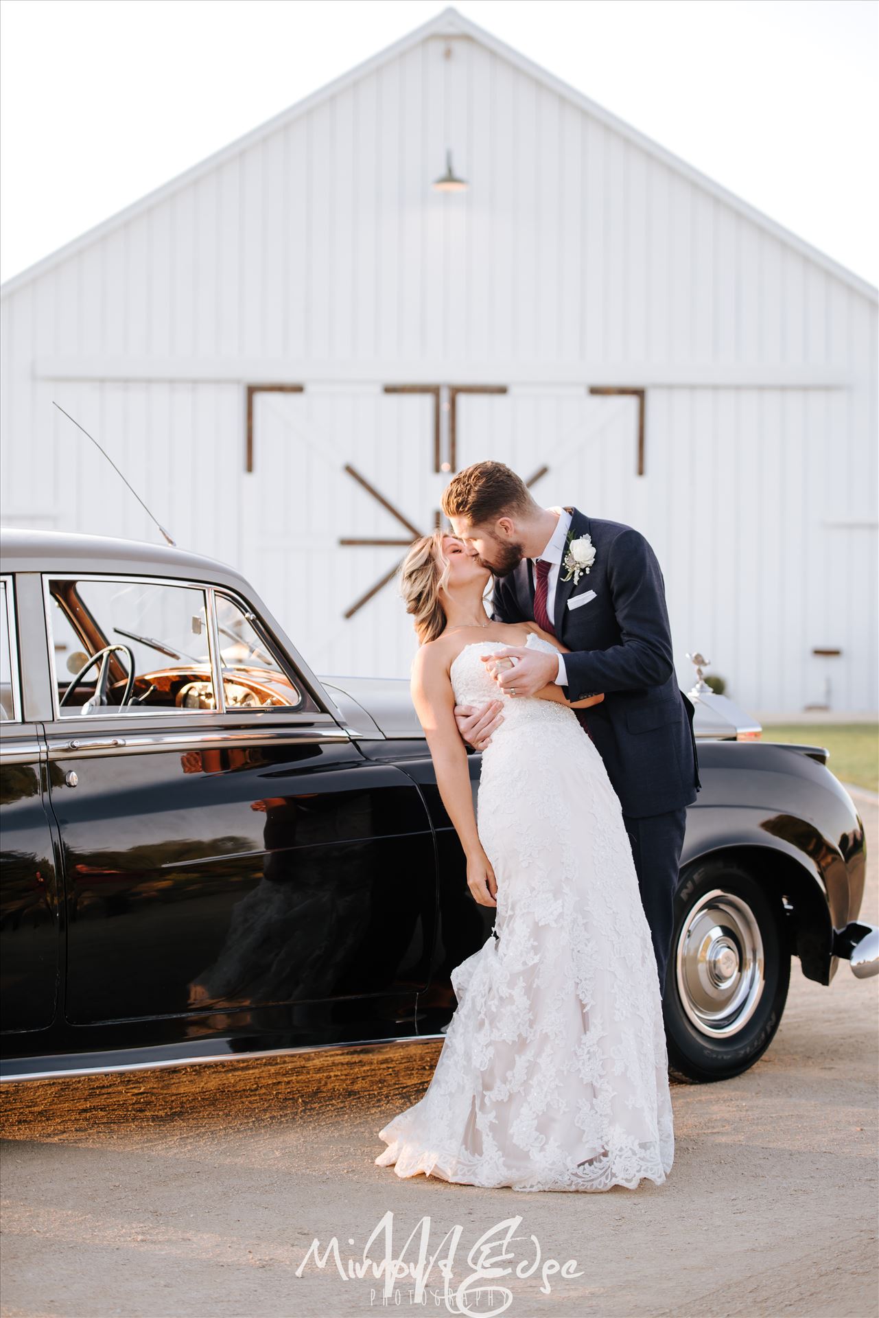 Port-7511.JPG White Barn in Edna Valley rustic chic wedding by Mirror's Edge Photography, San Luis Obispo County Wedding and Engagement Photographer.  Dip and kiss with Bride and Groom and Rolls Royce Wedding in front of the White Barn. by Sarah Williams