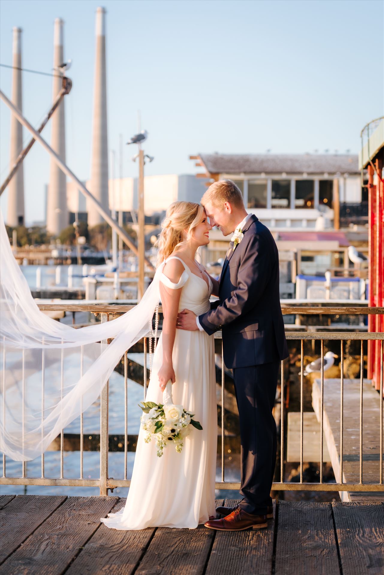 FW-8272.JPG Sarah Williams of Mirror's Edge Photography, a San Luis Obispo Wedding and Engagement Photographer, captures Ryan and Joanna's wedding at the iconic Windows on the Water Restaurant in Morro Bay, California.  Bride and Groom with bay in background. by Sarah Williams