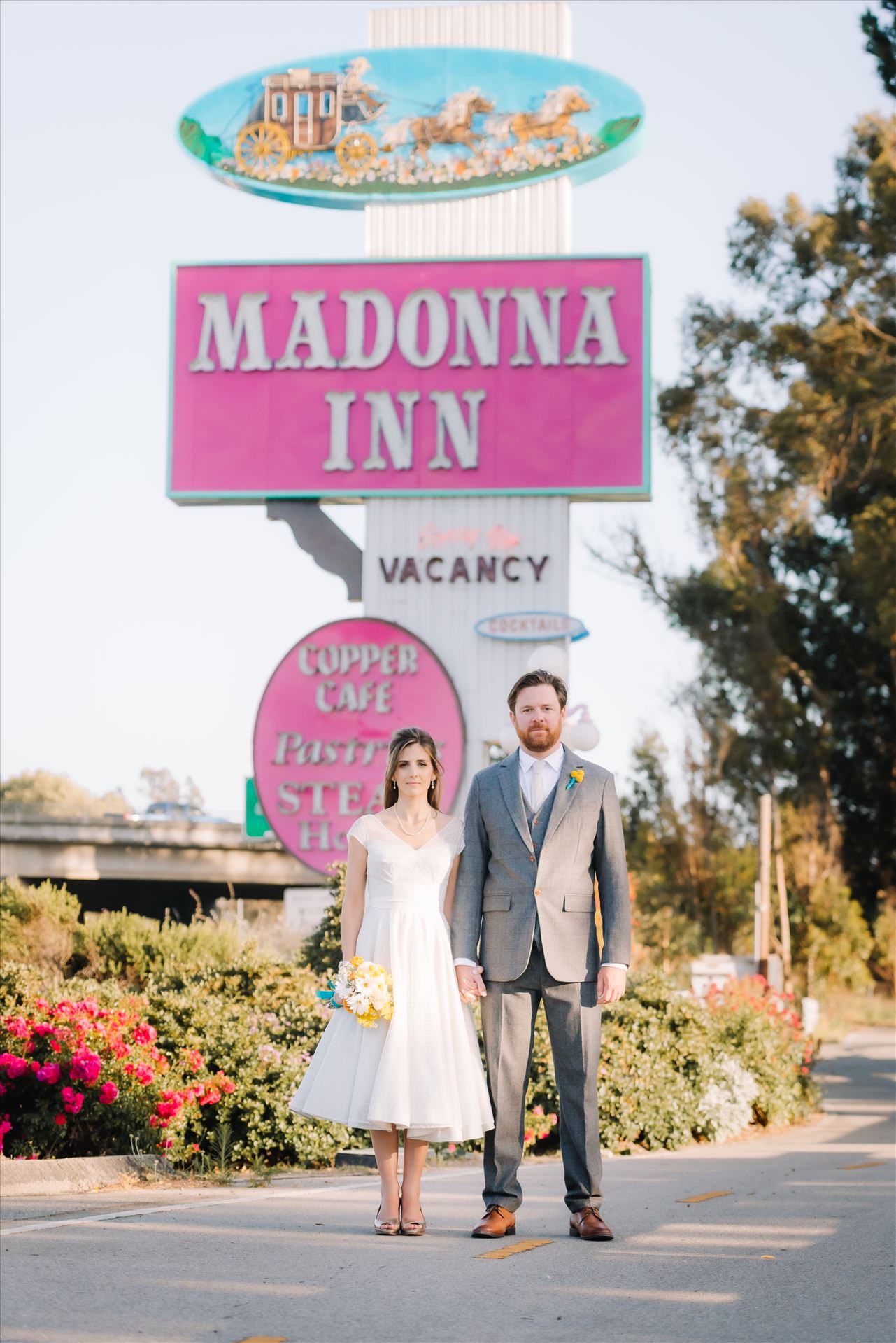 DSC_4274.JPG Mirror's Edge Photography captures Sarah and David's magical Madonna Inn Wedding in San Luis Obispo, California. Bride and Groom vintage vibe in front of Madonna Inn Sign. by Sarah Williams