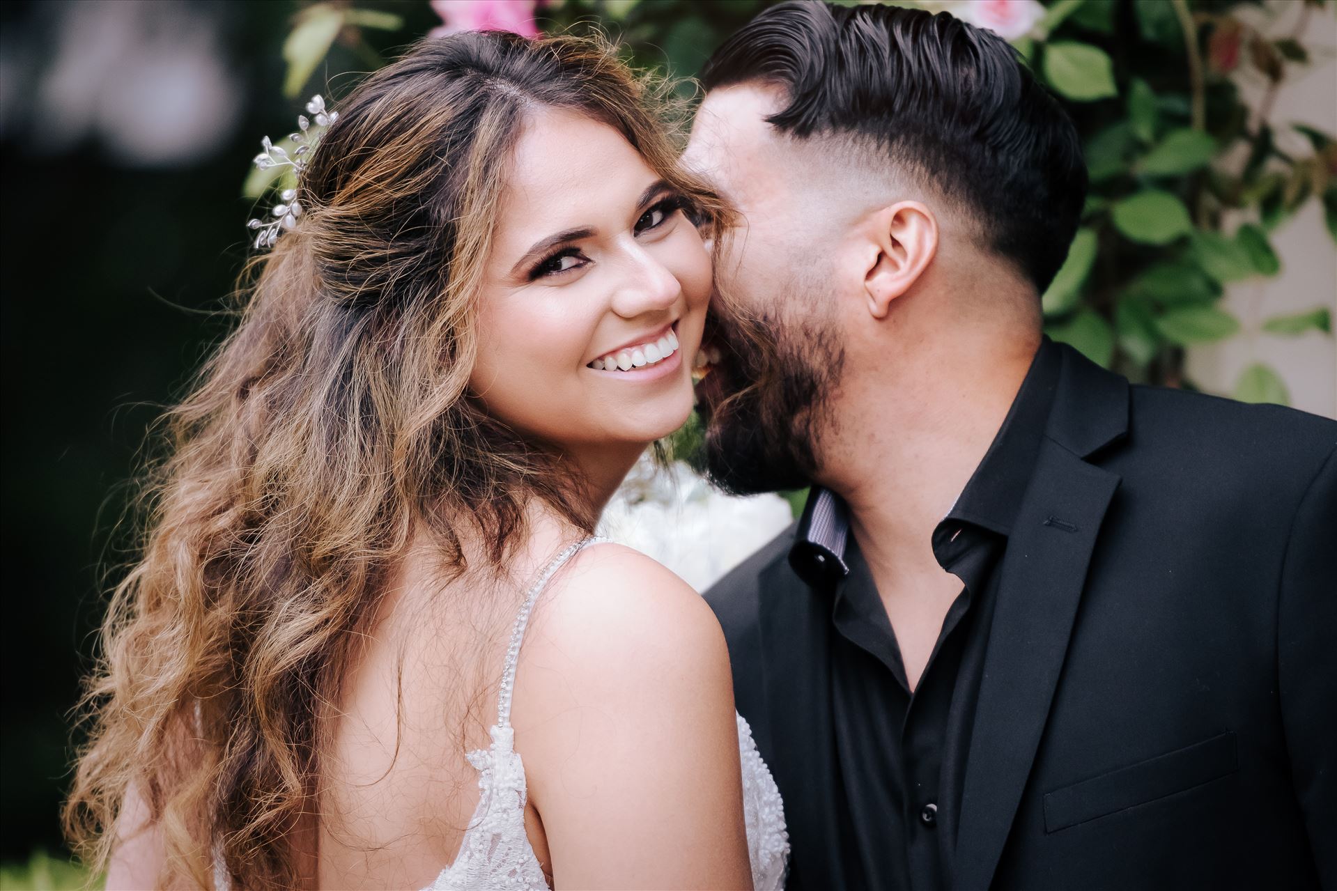 Final--23.JPG Kaleidoscope Inn and Gardens wedding in Nipomo in San Luis Obispo County by Mirror's Edge Photography.  Gorgeous rose gardens and Victorian home vibe with romance and deep colors.  Bride and Groom kiss by the roses by Sarah Williams