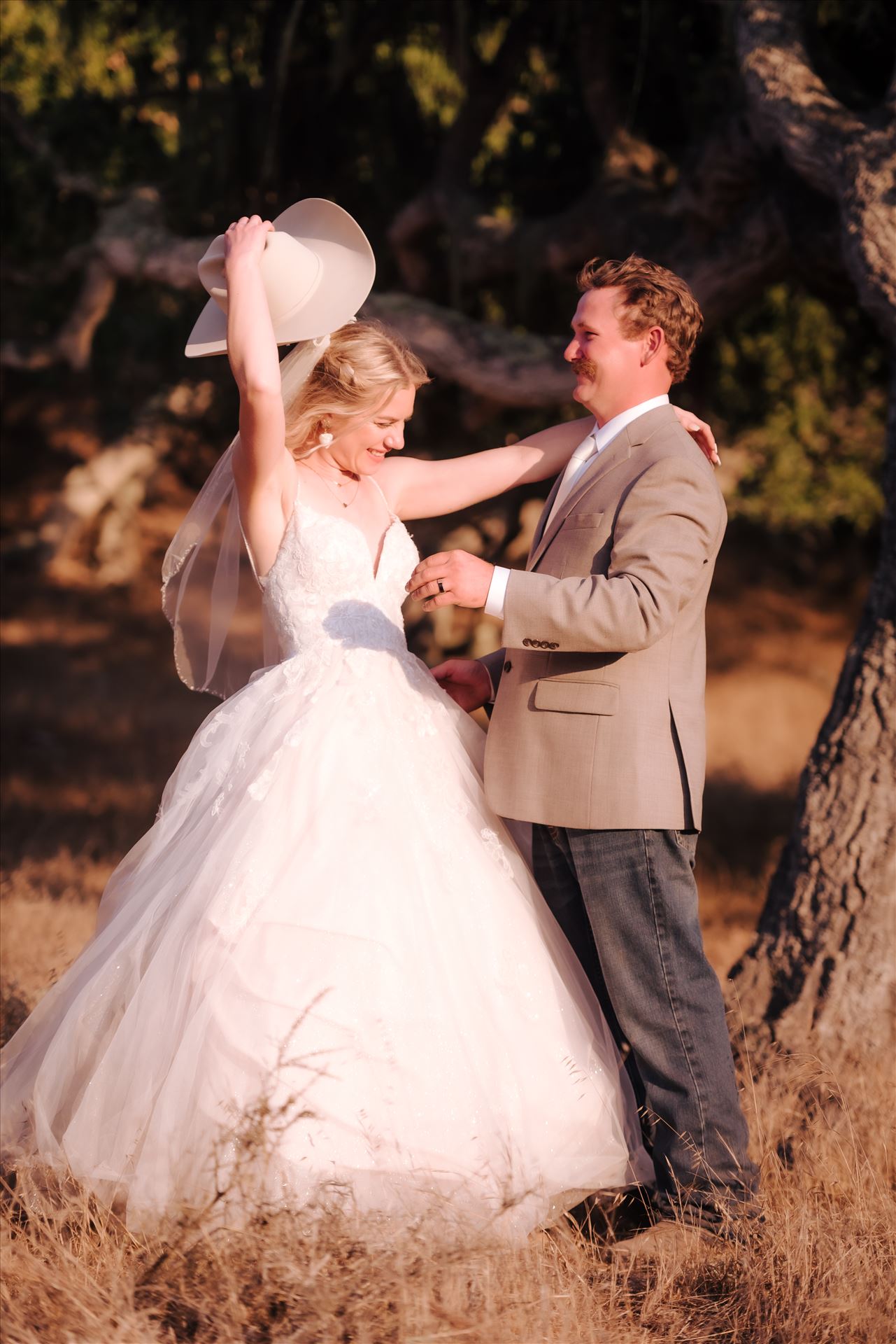 FW-6256.JPG Sarah Williams of Mirror's Edge Photography, a San Luis Obispo and Santa Barbara County Wedding and Engagement Photographer, captures Katie and Joe's country chic wedding in Lompoc, California.  Country Bride and Groom with Bride wearing Cowboy hat. by Sarah Williams
