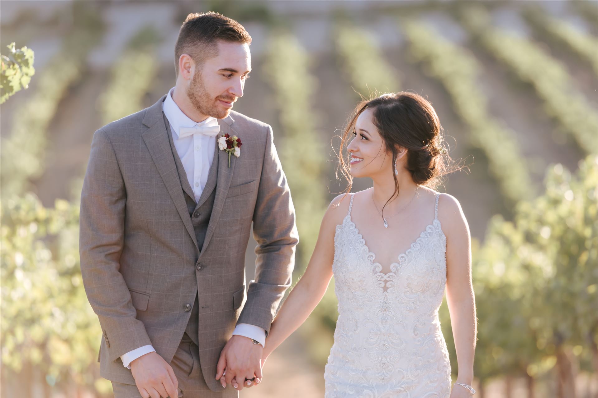 FW-6933.JPG Tooth and Nail Winery elegant and formal wedding in Paso Robles California wine country by Mirror's Edge Photography, San Luis Obispo County Wedding Photographer. Bride and Groom walking through the vineyards in Paso Robles California wine country wedding by Sarah Williams
