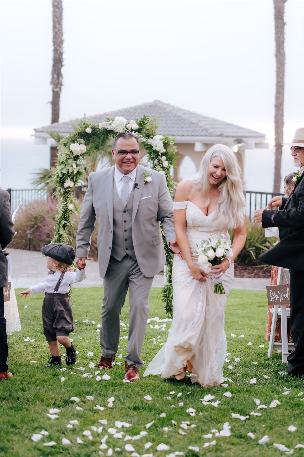 Final-8183.jpg Rainy day wedding at the Shore Cliff Hotel Gazebo in Pismo Beach, California in San Luis Obispo County by Mirror's Edge Photography.  Winter Wedding vibes at the Shore Cliff Gazebo Bride and Groom on lawn. by Sarah Williams