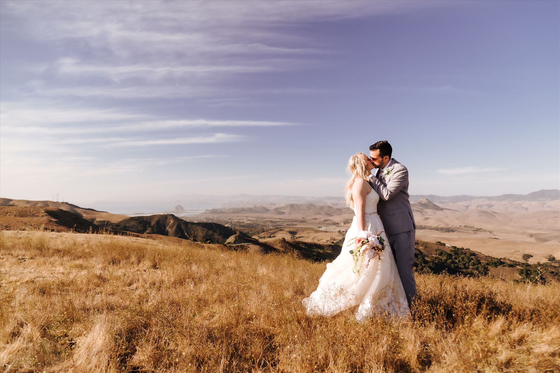 WW-9457.JPG Los Osos Private Ranch Wedding in San Luis Obispo County.  Gorgeous views of Morro Rock and golden hills.  Country wedding with boho flair.  Bride and Groom on a mountaintop. by Sarah Williams