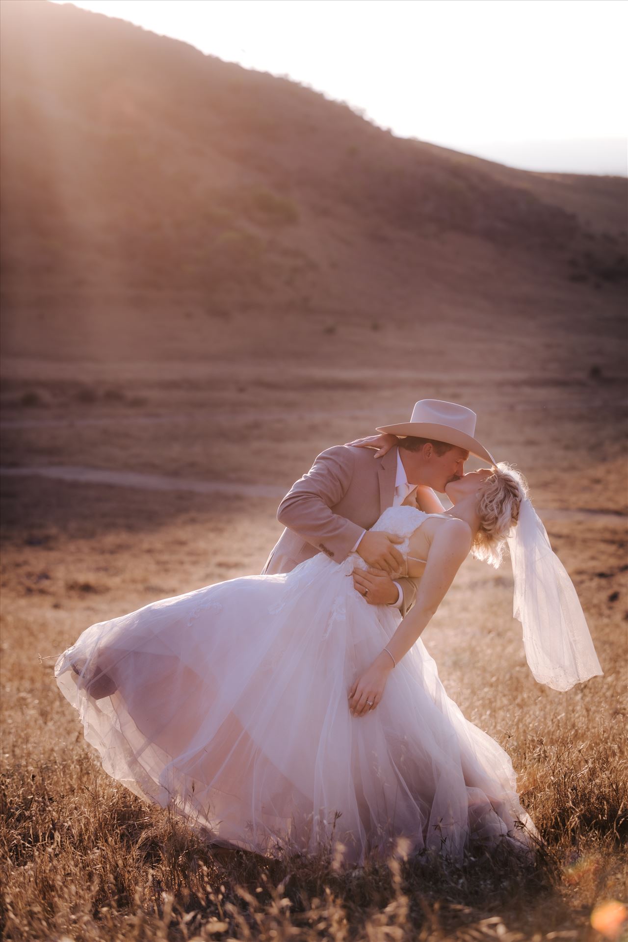 FW-1000.JPG Sarah Williams of Mirror's Edge Photography, a San Luis Obispo and Santa Barbara County Wedding and Engagement Photographer, captures Katie and Joe's country chic wedding in Lompoc, California.  Sunset glow dip and kiss on the family ranch. by Sarah Williams