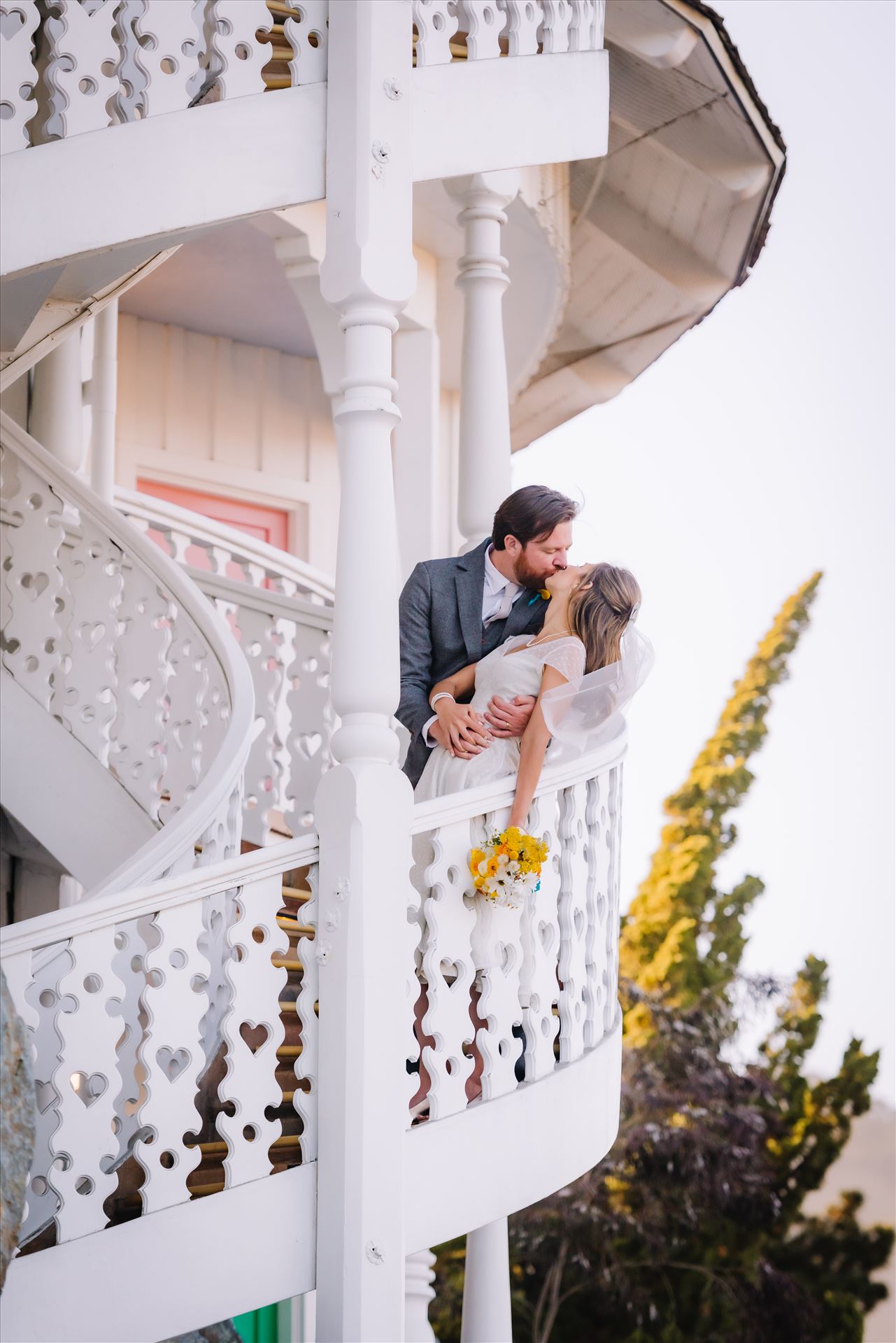 DSC_4250.JPG Mirror's Edge Photography captures Sarah and David's magical Madonna Inn Wedding in San Luis Obispo, California.  Bride and Groom kissing on spiral staircase. by Sarah Williams