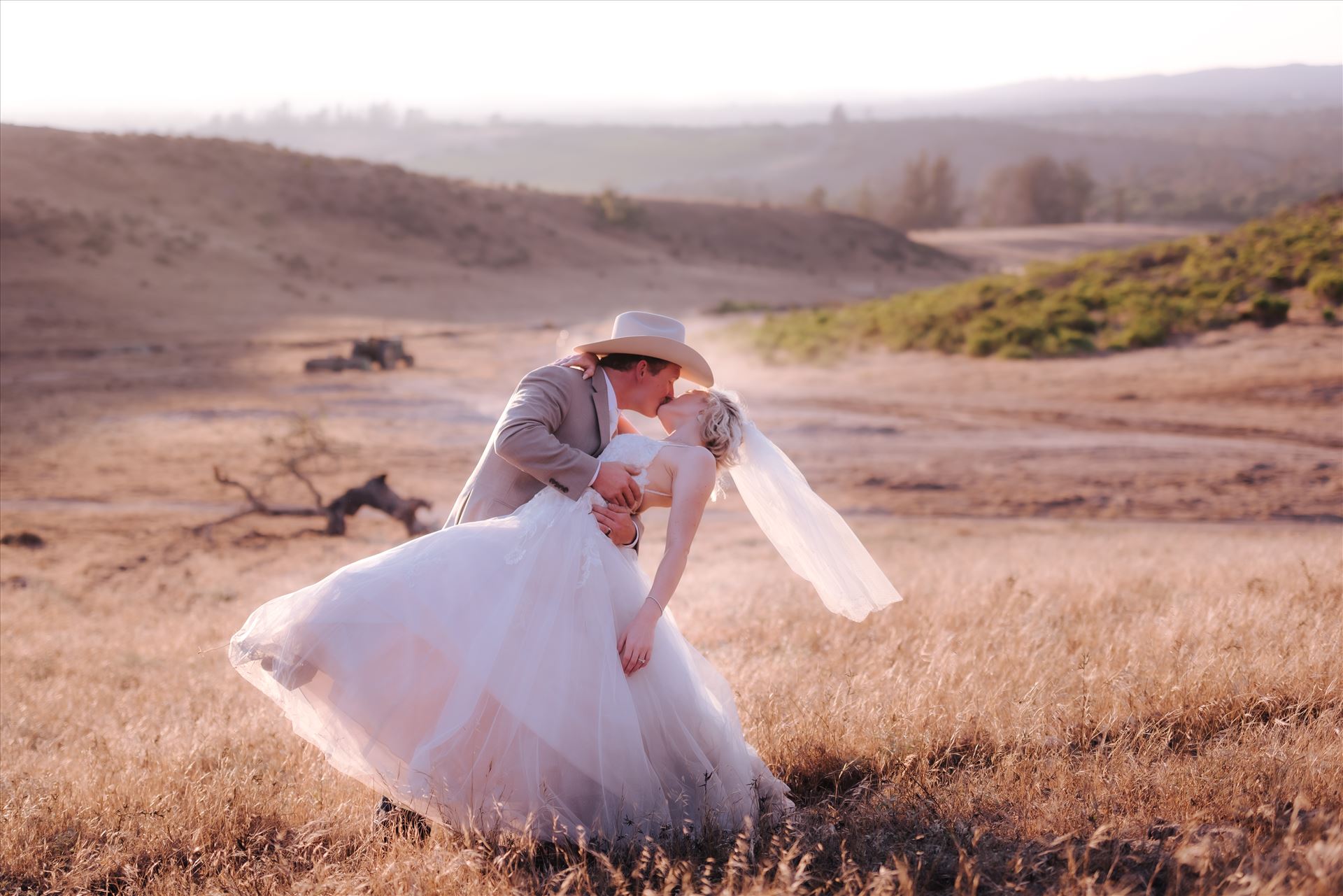 FW-6322.JPG Sarah Williams of Mirror's Edge Photography, a San Luis Obispo and Santa Barbara County Wedding and Engagement Photographer, captures Katie and Joe's country chic wedding in Lompoc, California.  Dip and kiss at sunset on the ranch. by Sarah Williams