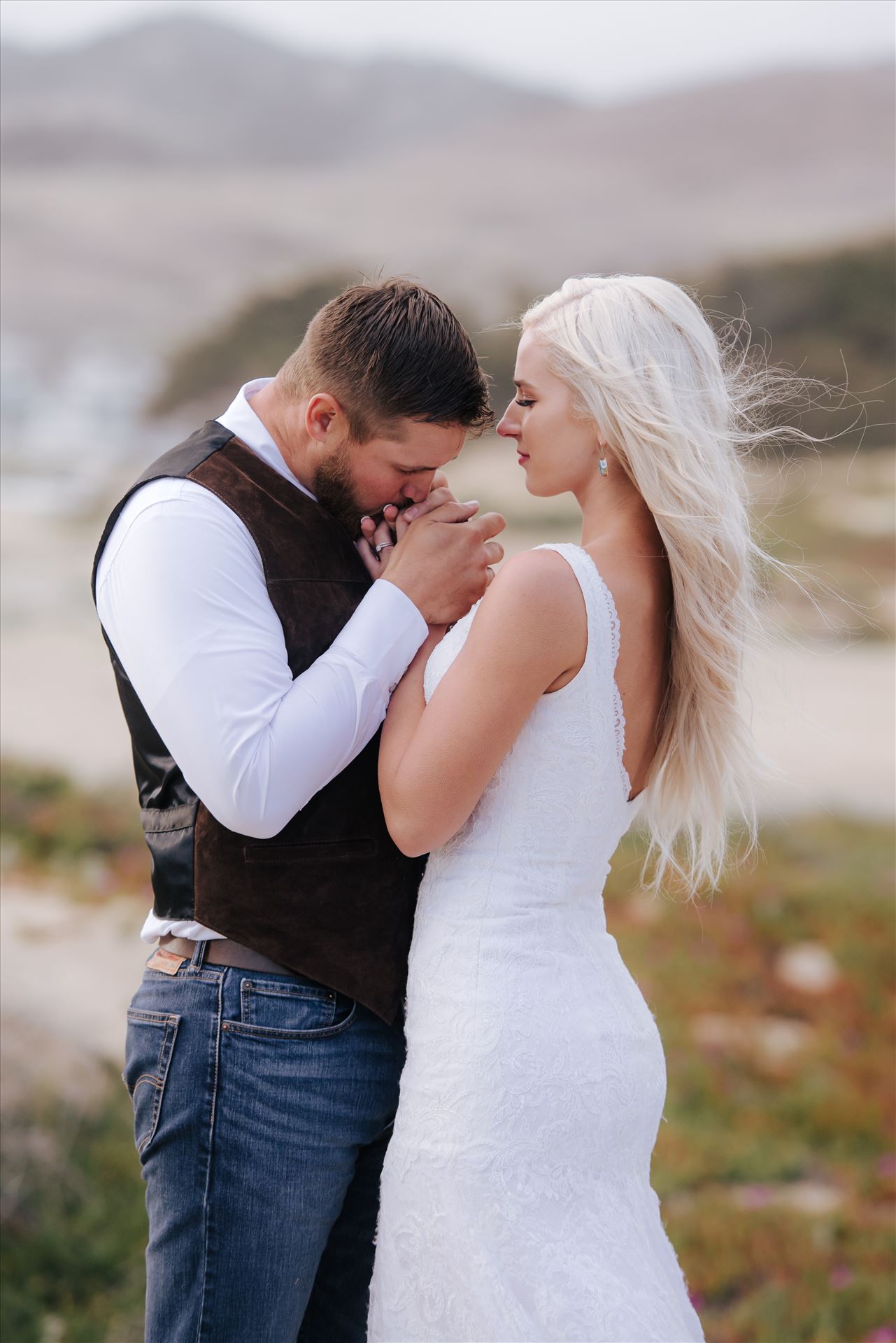 Sarah and Jeremy 71 Mirror's Edge Photography, a San Luis Obispo County Wedding and Engagement Photographer, captures Sarah and Jeremy's intimate wedding on Pismo State Beach in Grover Beach, California.  Bride and Groom love and tenderness with pismo in the background by Sarah Williams