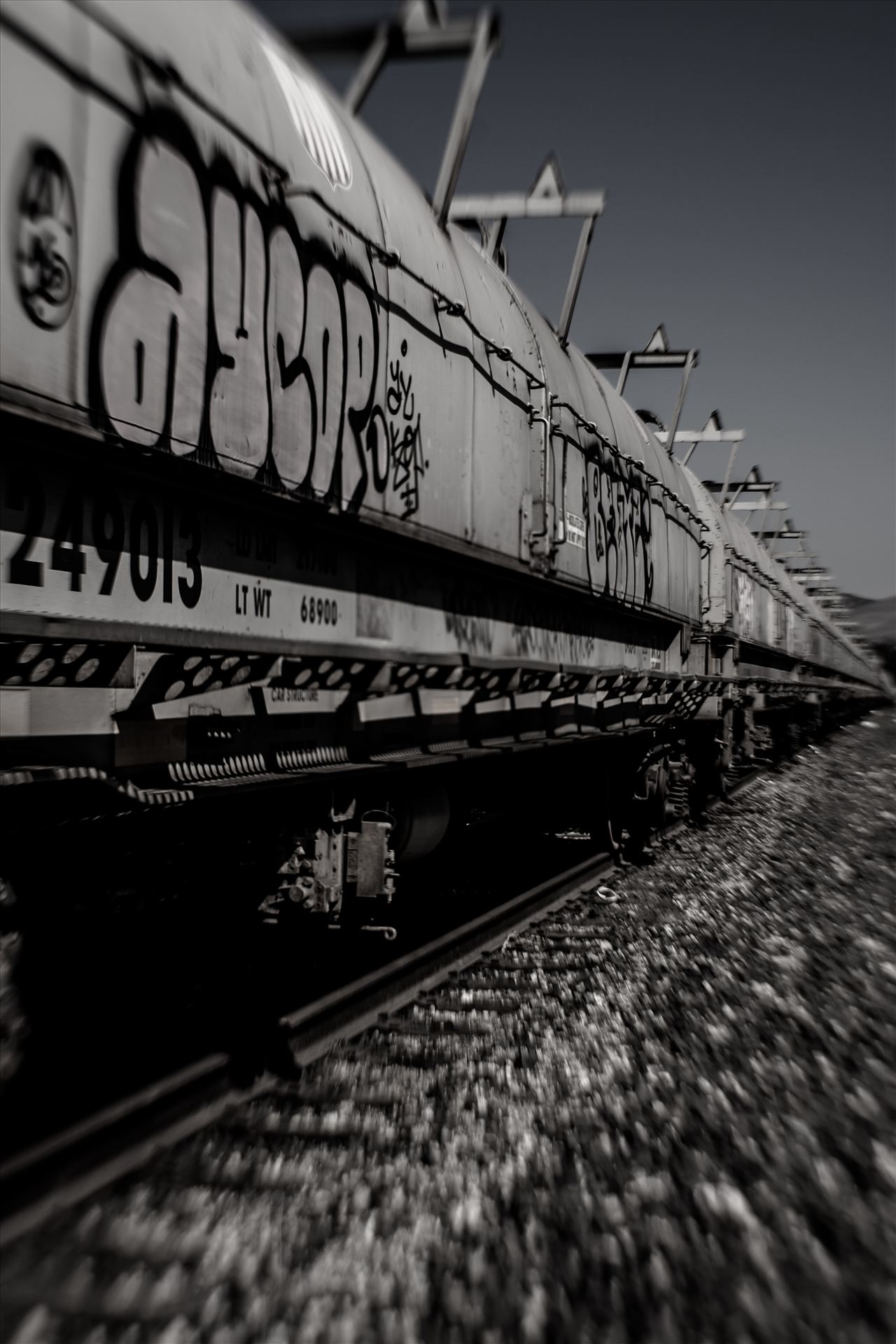 Graffiti Tankers Desaturated.jpg Graffiti on oil tankers and infinity train tracks by Sarah Williams
