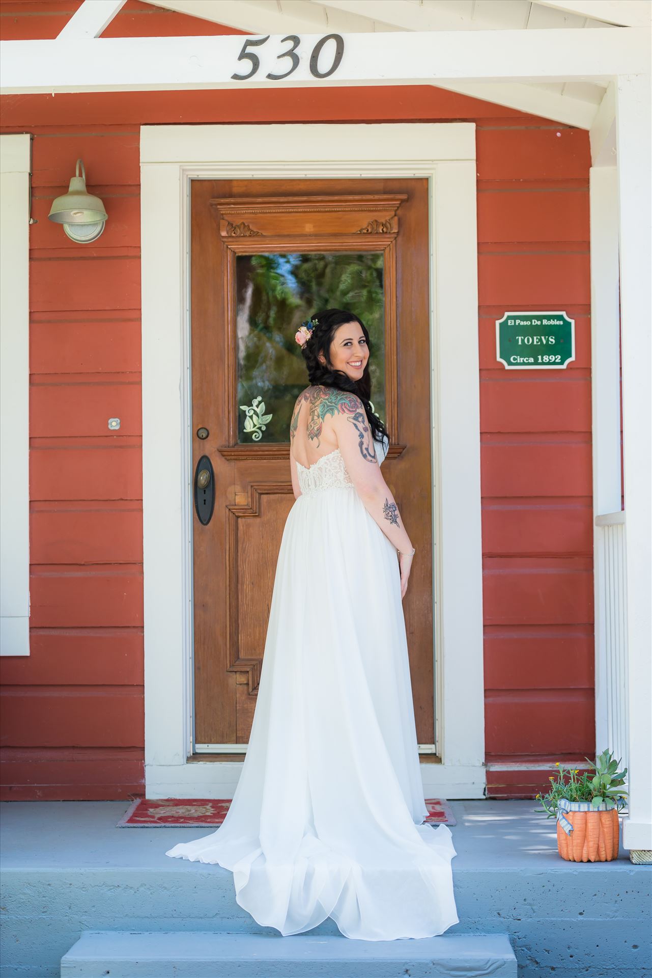 Kendra and Mitchell 029 Emily House Bed and Breakfast Paso Robles California Wedding Photography by Mirrors Edge Photography. Bride on the porch by Sarah Williams