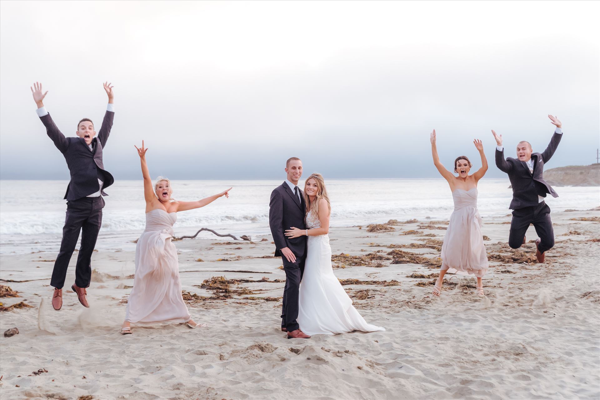 Courtney and Doug 69 Mirror's Edge Photography, San Luis Obispo Wedding Photographer captures Cayucos Wedding on the beach and bluffs in Cayucos Central California Coast. Wedding Party Bridal Party fun at the Beach by Sarah Williams