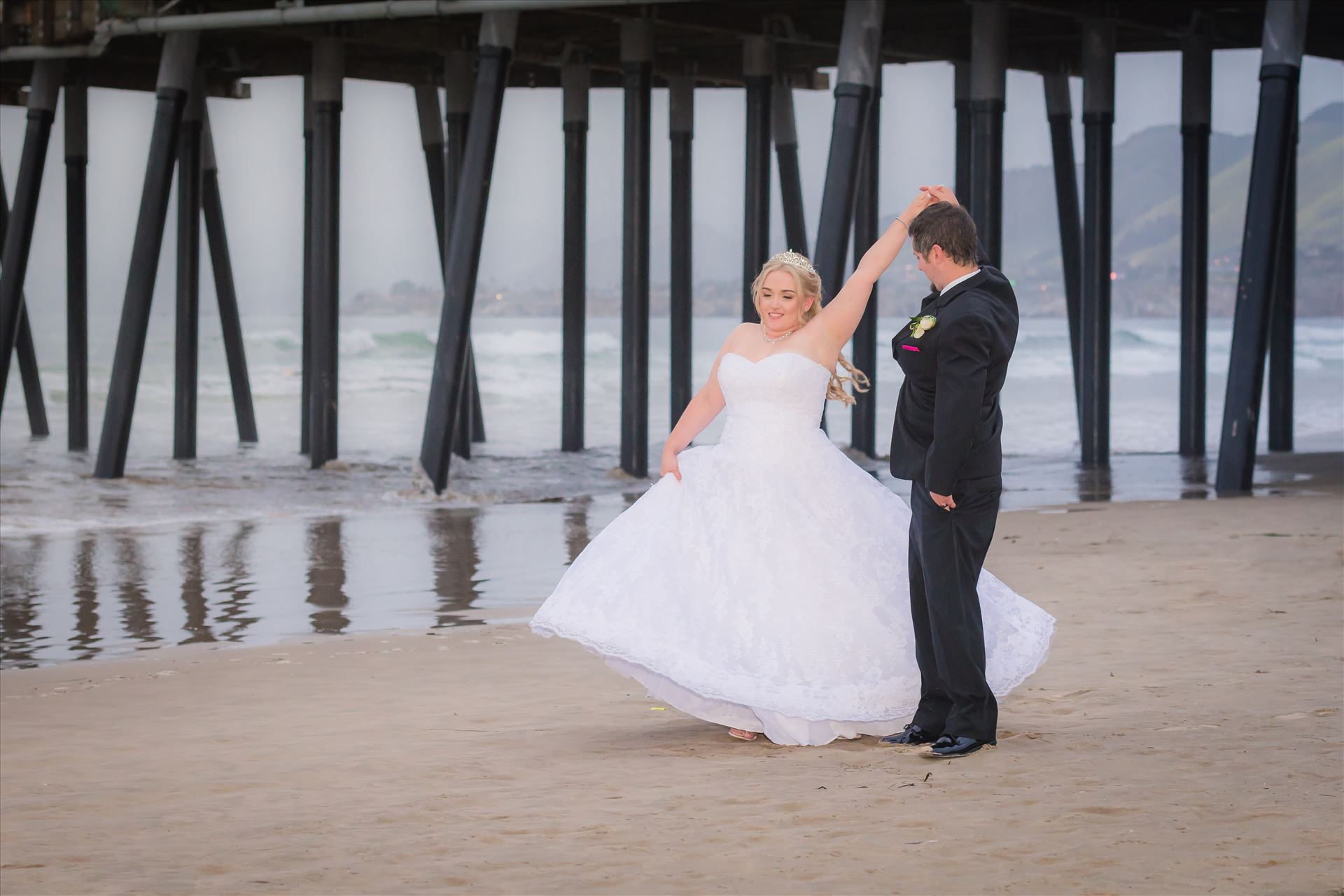 Jessica and Michael 68 Sea Venture Resort and Spa Wedding Photography by Mirror's Edge Photography in Pismo Beach, California. Bride and Groom at Pismo Beach Pier by Sarah Williams