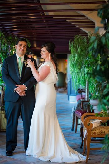 Mary and Alejandro 15 - Wedding photography at the Historic Santa Maria Inn in Santa Maria, California by Mirror\u0027s Edge Photography. Bride and Groom in breezeway between the Taproom and the Front Desk at the Santa Maria Inn.