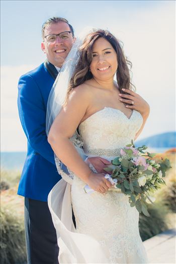 Candy and Christopher 26 - Wedding at Dolphin Bay Resort and Spa in Shell Beach, California by Sarah Williams of Mirror\u0027s Edge Photography, a San Luis Obispo County Wedding Photographer. Bride and Groom by the Ocean after wedding.